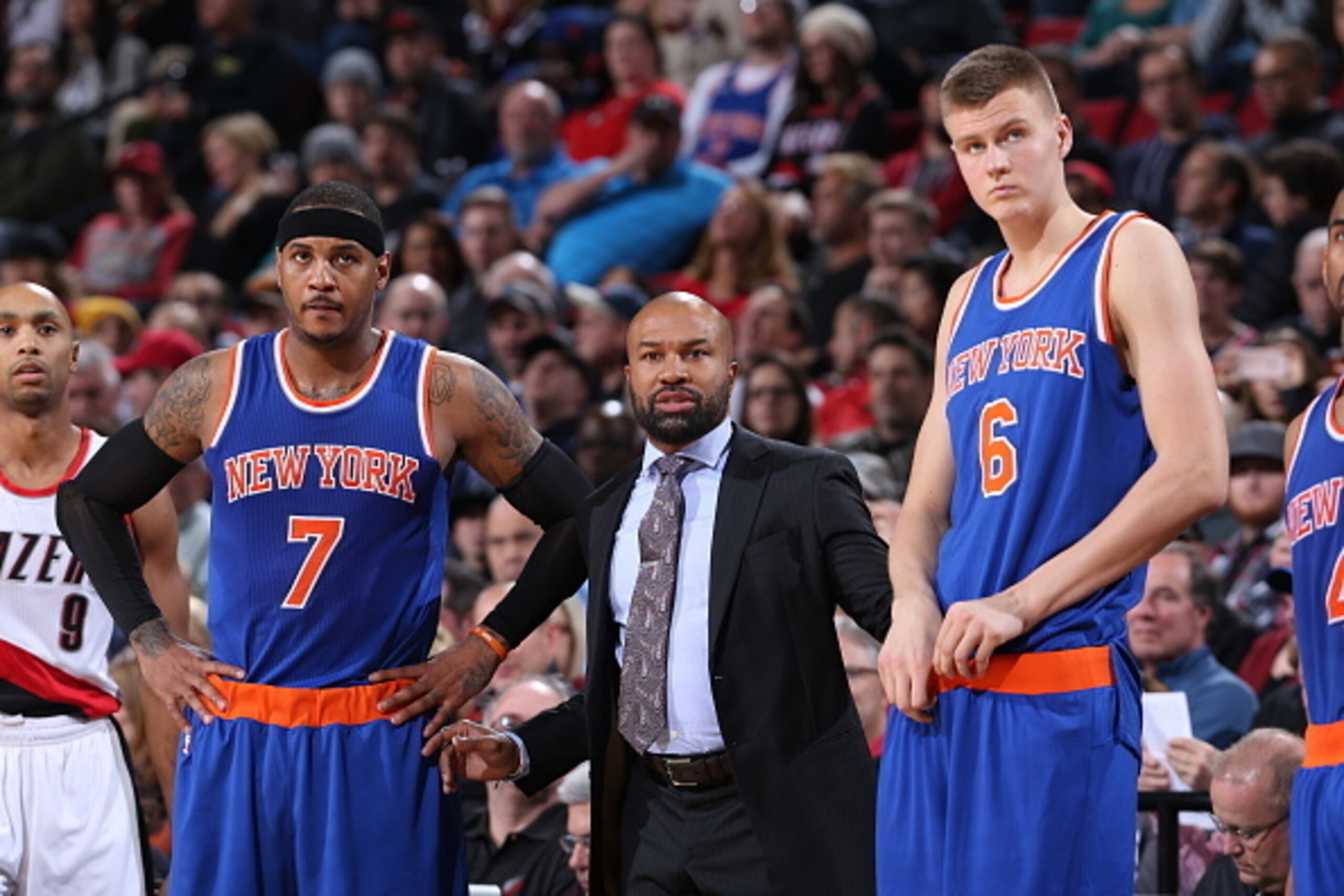 PORTLAND, OR - DECEMBER 12:  Head Coach Derek Fisher of the New York Knicks looks on with Carmelo Anthony #7 and Kristaps Porzingis #6 during the game against the Portland Trail Blazers on December 12, 2015 at the Moda Center in Portland, Oregon. NOTE TO 