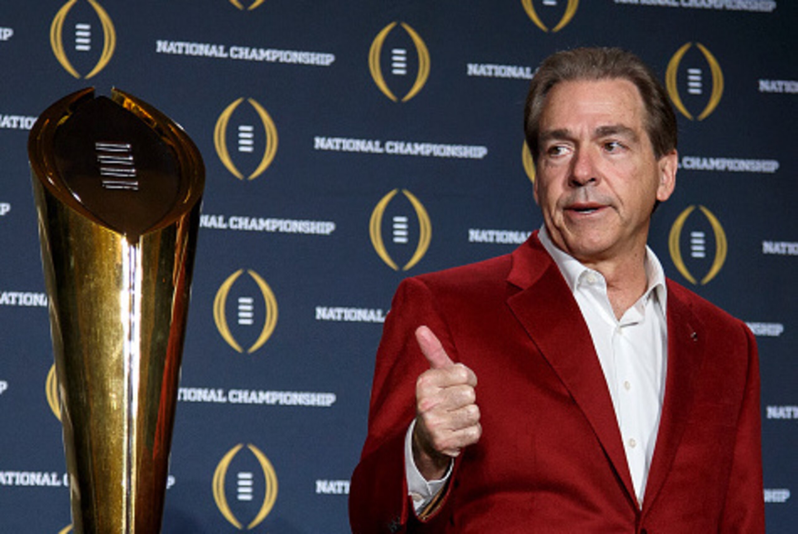 SCOTTSDALE, AZ - JANUARY 12: Head Coach Nick Saban of the Alabama Crimson Tide pose with the College Football Playoff National Championship Trophy during the MVP Press Conference after winning the College Football Playoff National Championship at the JW M