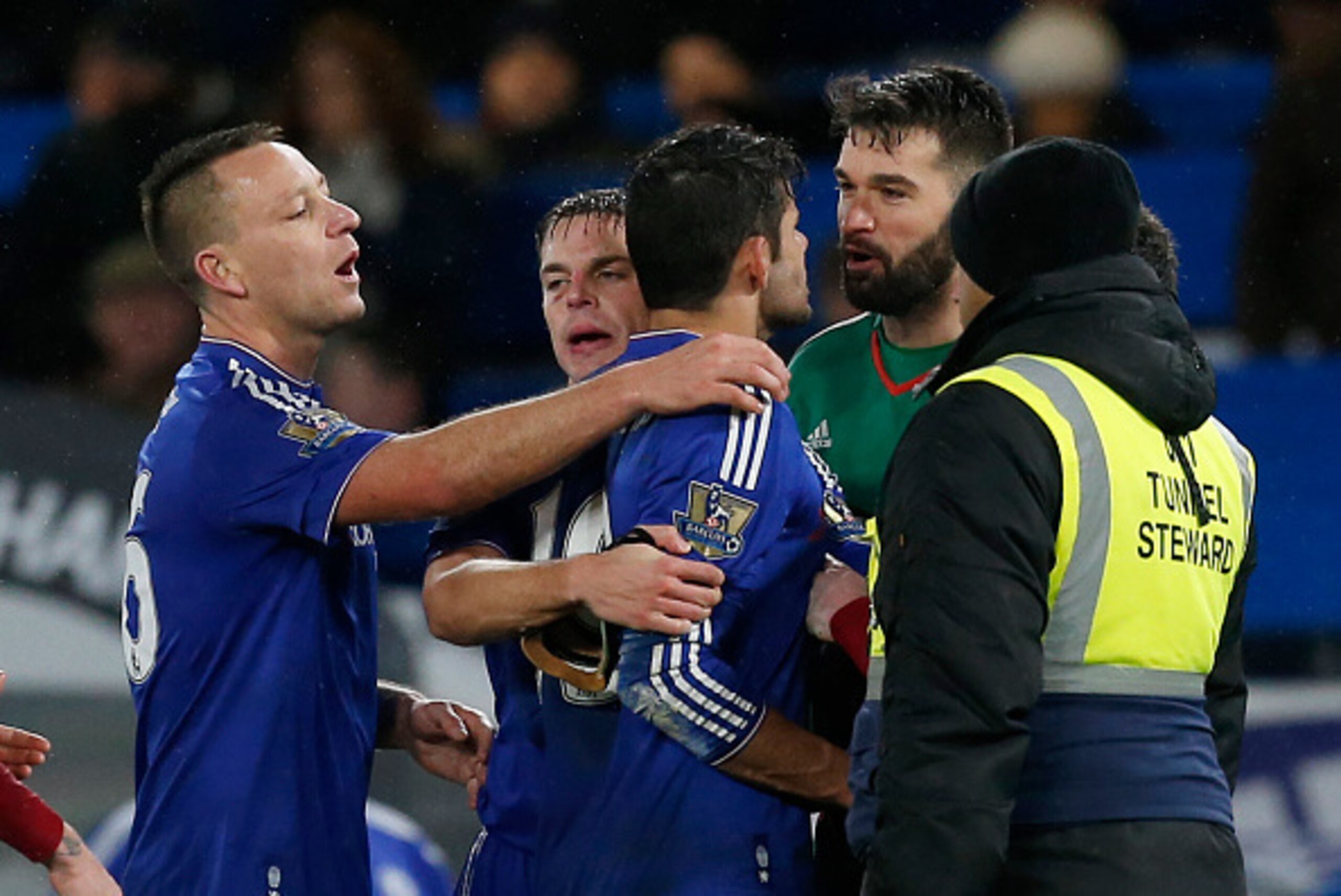 Chelsea's Brazilian-born Spanish striker Diego Costa (C) clashes with West Bromwich Albion's US-born Welsh goalkeeper Boaz Myhill after the English Premier League football match between Chelsea and West Bromwich Albion at Stamford Bridge in London on Janu