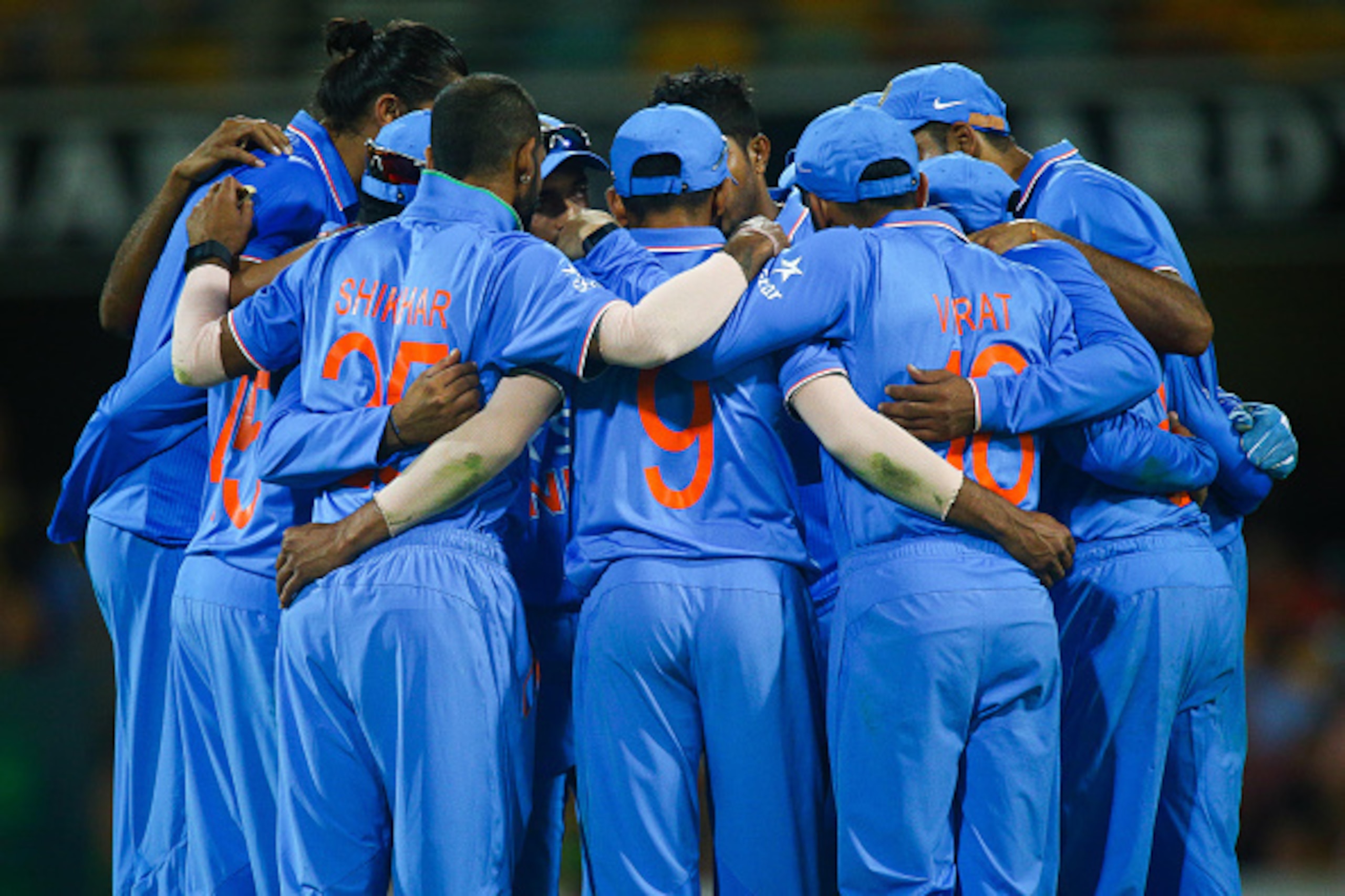 India's  player's huddle together during the final drinks break during the one-day international cricket match between India and Australia in Brisbane on January 15, 2016.  AFP PHOTO / PATRICK HAMILTON --IMAGE RESTRICTED TO EDITORIAL USE Ð NO COMMERCIAL U