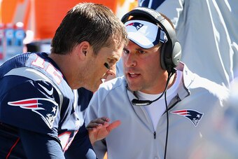 FOXBORO, MA - SEPTEMBER 27:  Josh McDaniels, offensive coordinator for the New England Patriots congratulates  Tom Brady #12 of the New England Patriots after his 400th career touchdown pass during the first half against the Jacksonville Jaguars at Gillet