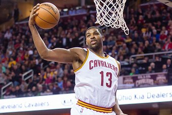 CLEVELAND, OH - JANUARY 4: Tristan Thompson #13 of the Cleveland Cavaliers grabs a rebound during the first half against the Toronto Raptors at Quicken Loans Arena on January 4, 2016 in Cleveland, Ohio. NOTE TO USER: User expressly acknowledges and agrees