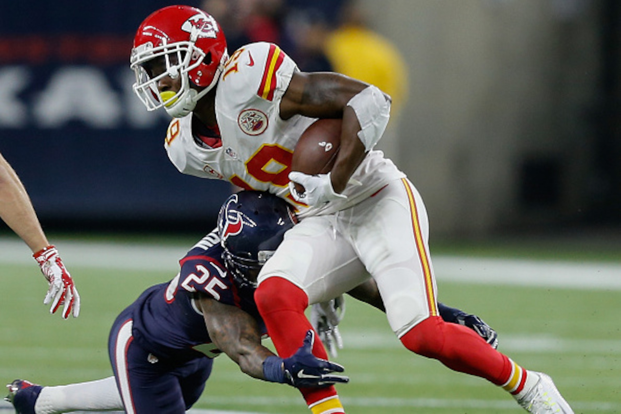 HOUSTON, TX - JANUARY 09:  Jeremy Maclin #19 of the Kansas City Chiefs is tackled by Kareem Jackson #25 of the Houston Texans during the AFC Wild Card game at NRG Stadium on January 9, 2016 in Houston, Texas.  (Photo by Bob Levey/Getty Images)
