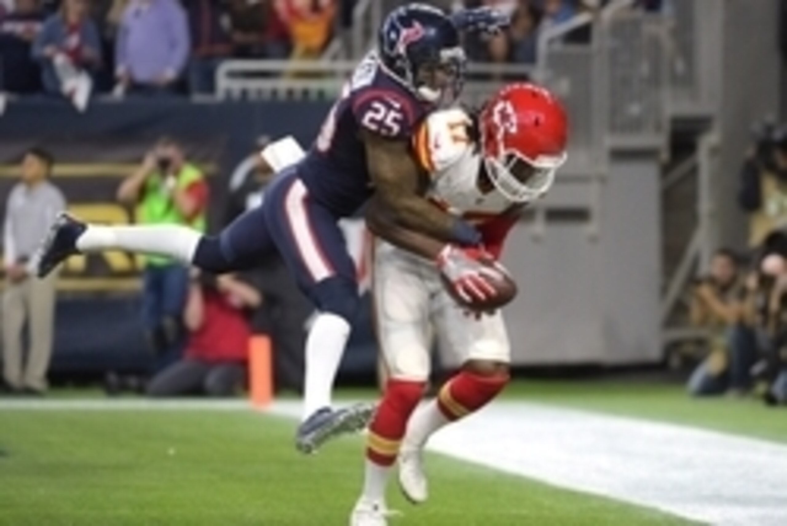 Jan 9, 2016; Houston, TX, USA; Kansas City Chiefs wide receiver Chris Conley (17) catches a touchdown pass against Houston Texans cornerback Kareem Jackson (25) during the in the third quarter in a AFC Wild Card playoff football game at NRG Stadium. Kansa