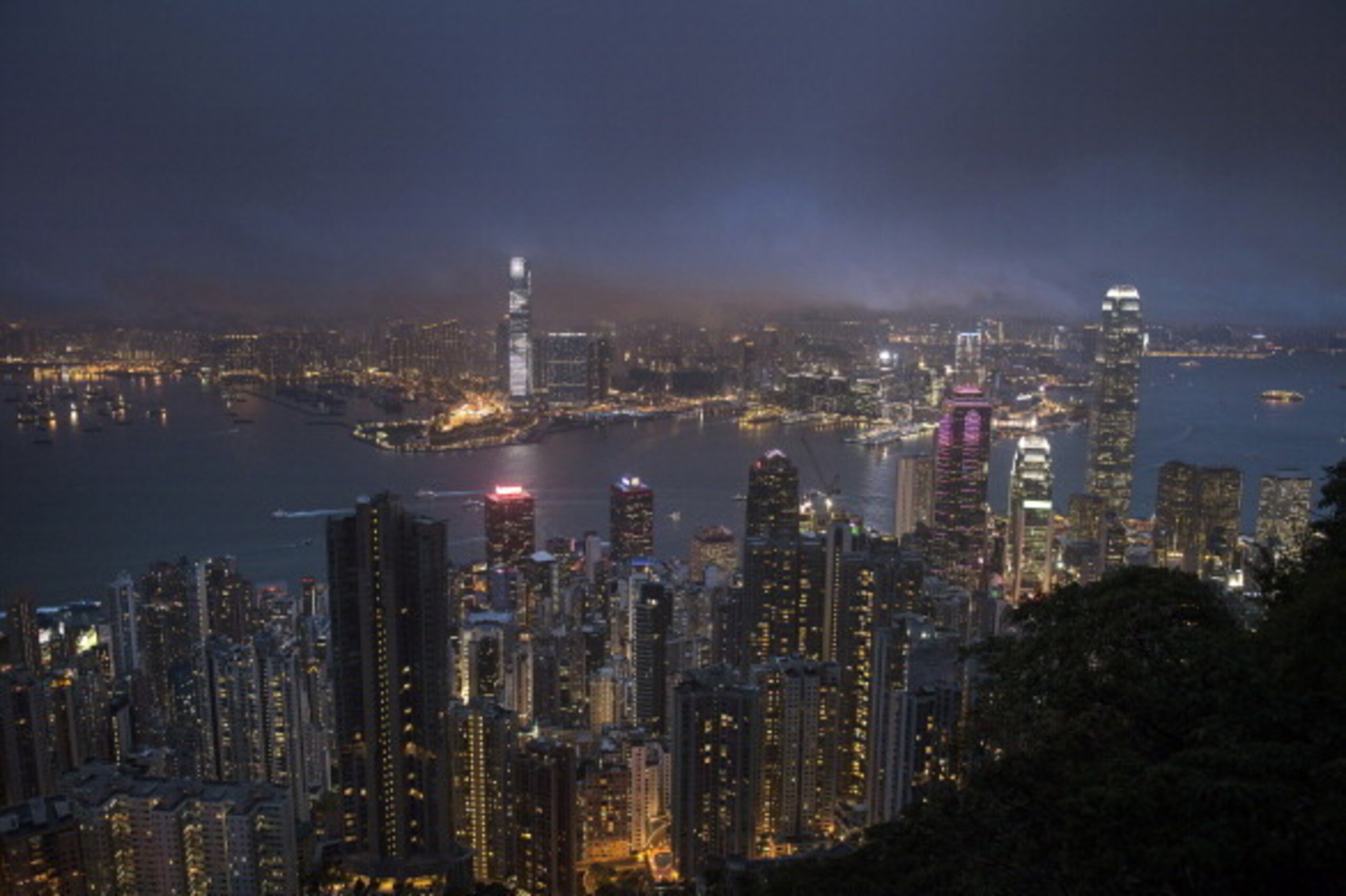 Clouds clear away from Victoria Harbour after a rainstorm in Hong Kong on May 8, 2014. Hong Kong's economy is expected to expand at its fastest pace in three years in 2014, the government said this year, while slashing public welfare spending as it projec