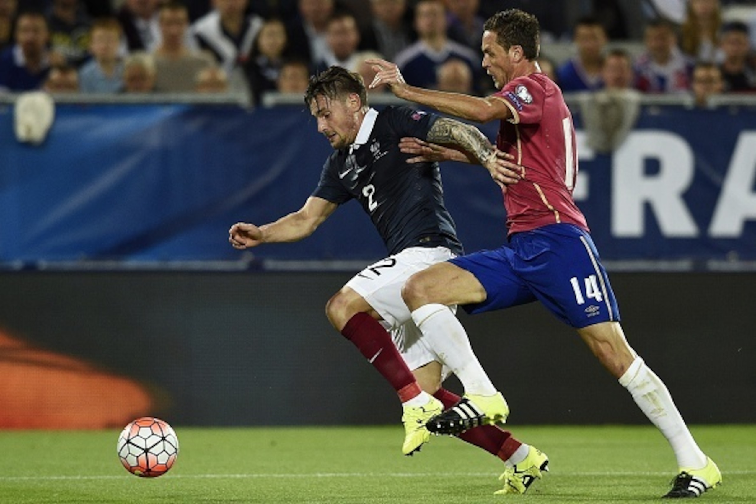France's midfielder Mathieu Debuchy (L) vies with Serbias midfielder Nemanja Matic during the Euro 2016 friendly football match France vs Serbia at the Matmut Atlantique stadium in Bordeaux on September 7, 2015.   AFP PHOTO/ FRANCK FIFE        (Photo cred