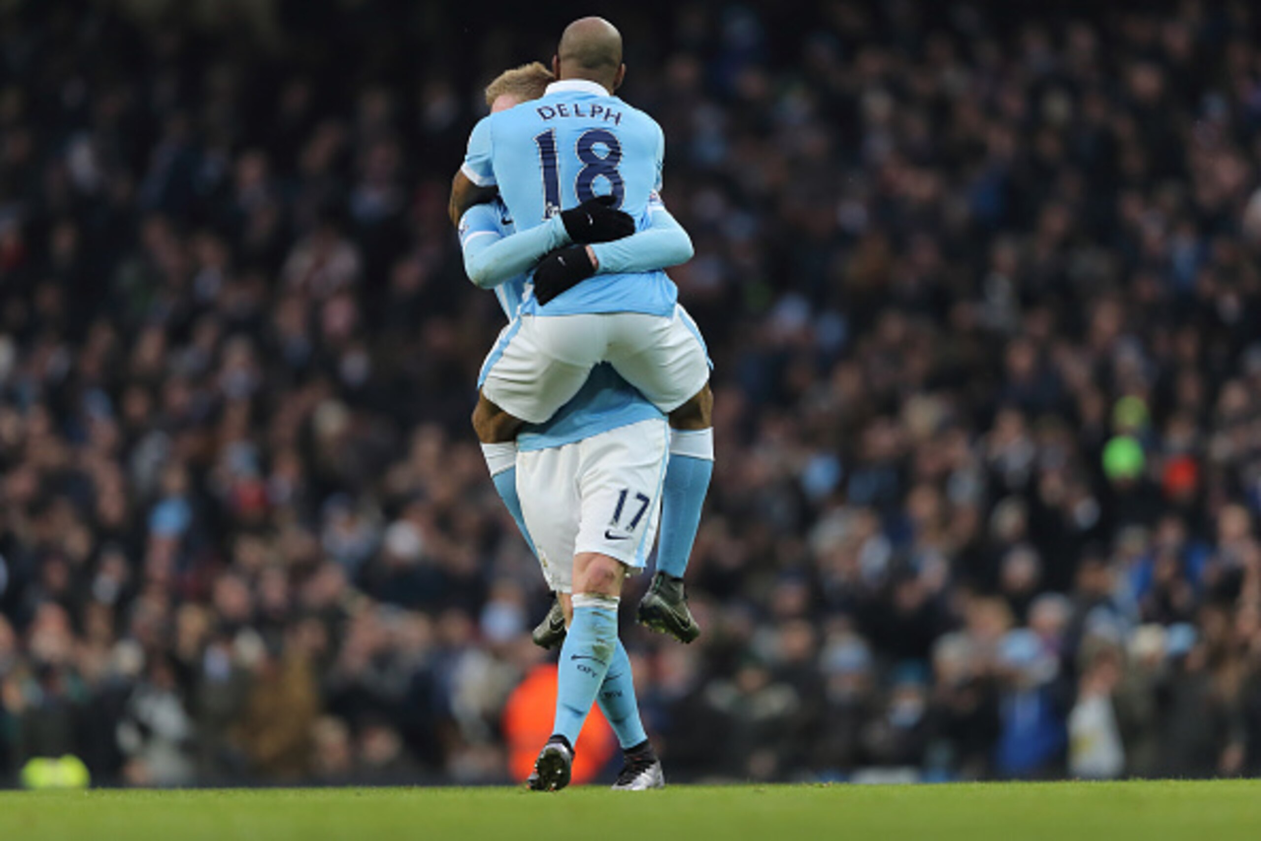 MANCHESTER, ENGLAND - JANUARY 16:  Fabian Delph of Manchester City celebrates after scoring a goal to make it 1-0 with Kevin De Bruyne during the Barclays Premier League match between Manchester City and Crystal Palace at the Etihad Stadium on January 16,
