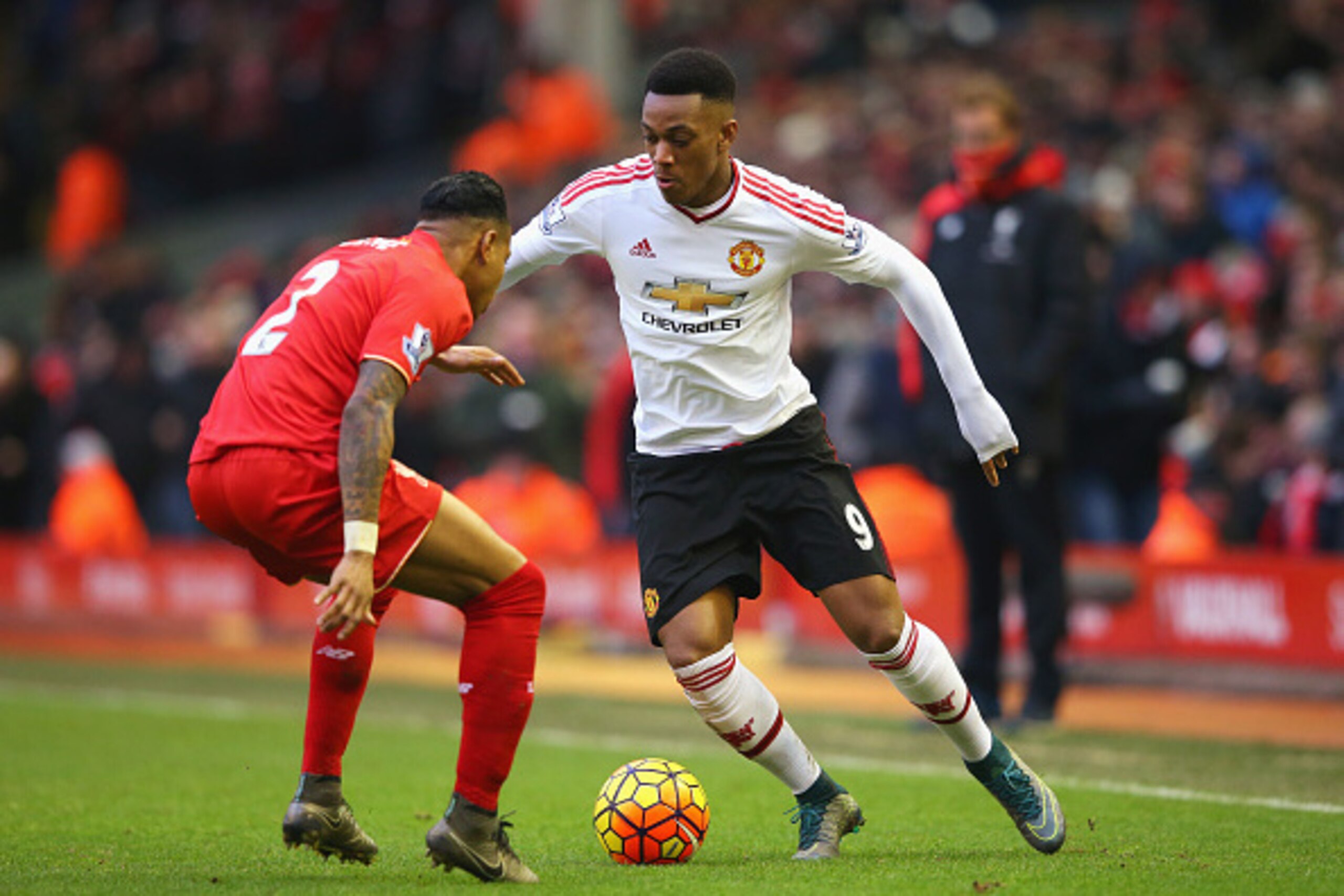 LIVERPOOL, ENGLAND - JANUARY 17: Anthony Martial of Manchester United takes on Nathaniel Clyne of Liverpool during the Barclays Premier League match between Liverpool and Manchester United at Anfield on January 17, 2016 in Liverpool, England.  (Photo by A