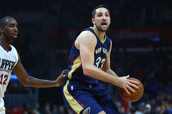 LOS ANGELES, CA - JANUARY 10:  Ryan Anderson #33 of the New Orleans Pelicans looks to make a pass as Luc Richard Mbah a Moute #12 of the Los Angeles Clippers defends in the first half during the NBA game at Staples Center on January 10, 2016 in Los Angele