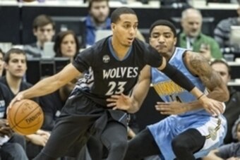 Dec 15, 2015; Minneapolis, MN, USA; Minnesota Timberwolves guard Kevin Martin (23) dribbles the ball around Denver Nuggets guard Gary Harris (14) in the first half at Target Center. Mandatory Credit: Jesse Johnson-USA TODAY Sports