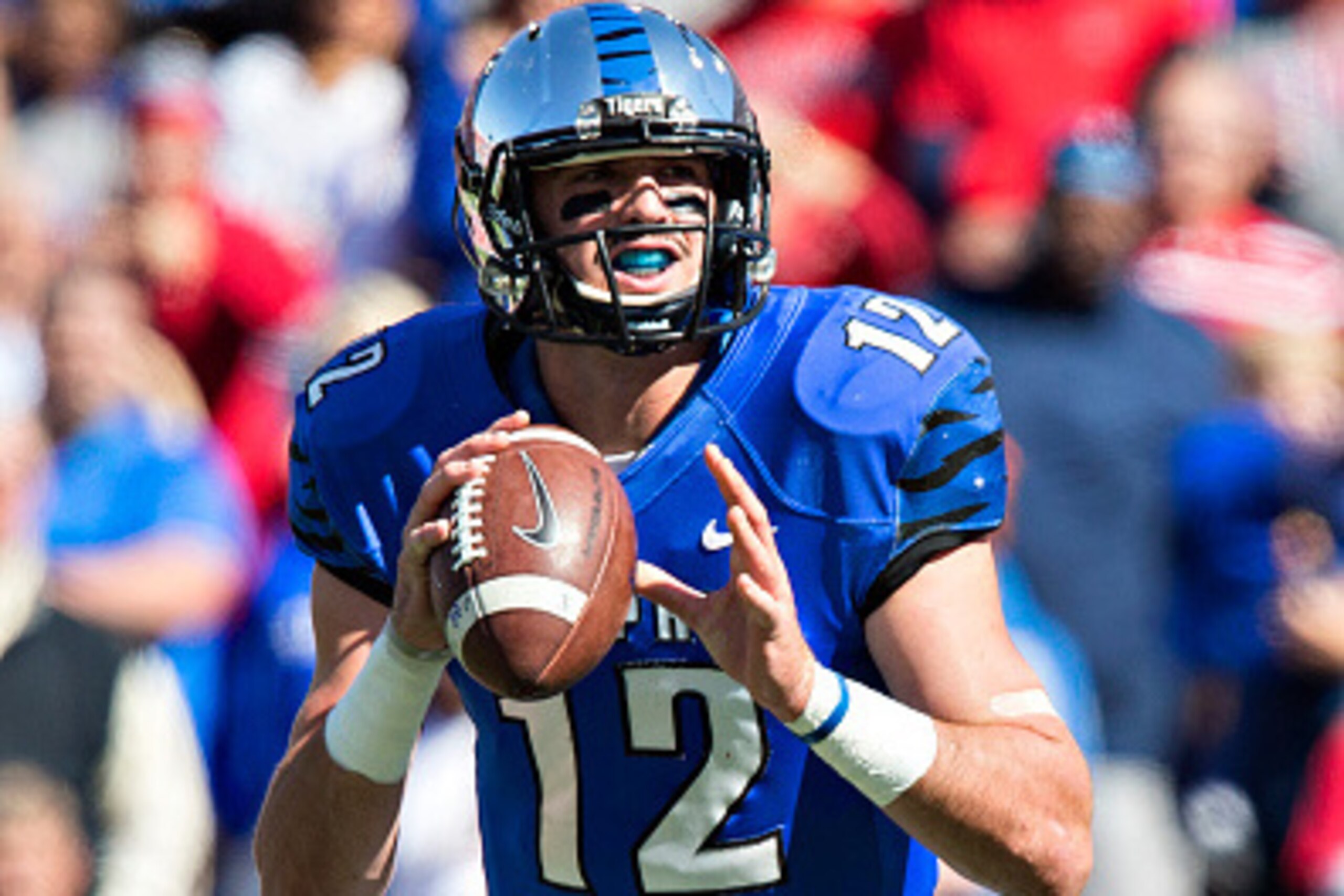 MEMPHIS, TN - OCTOBER 17:  Paxton Lynch #12 of the Memphis Tigers rolls out to pass during a game against the Ole Miss Rebels at Liberty Bowl Memorial Stadium on October 17, 2015 in Memphis, Tennessee.  The Tigers defeated the Rebels 37-24.  (Photo by Wes