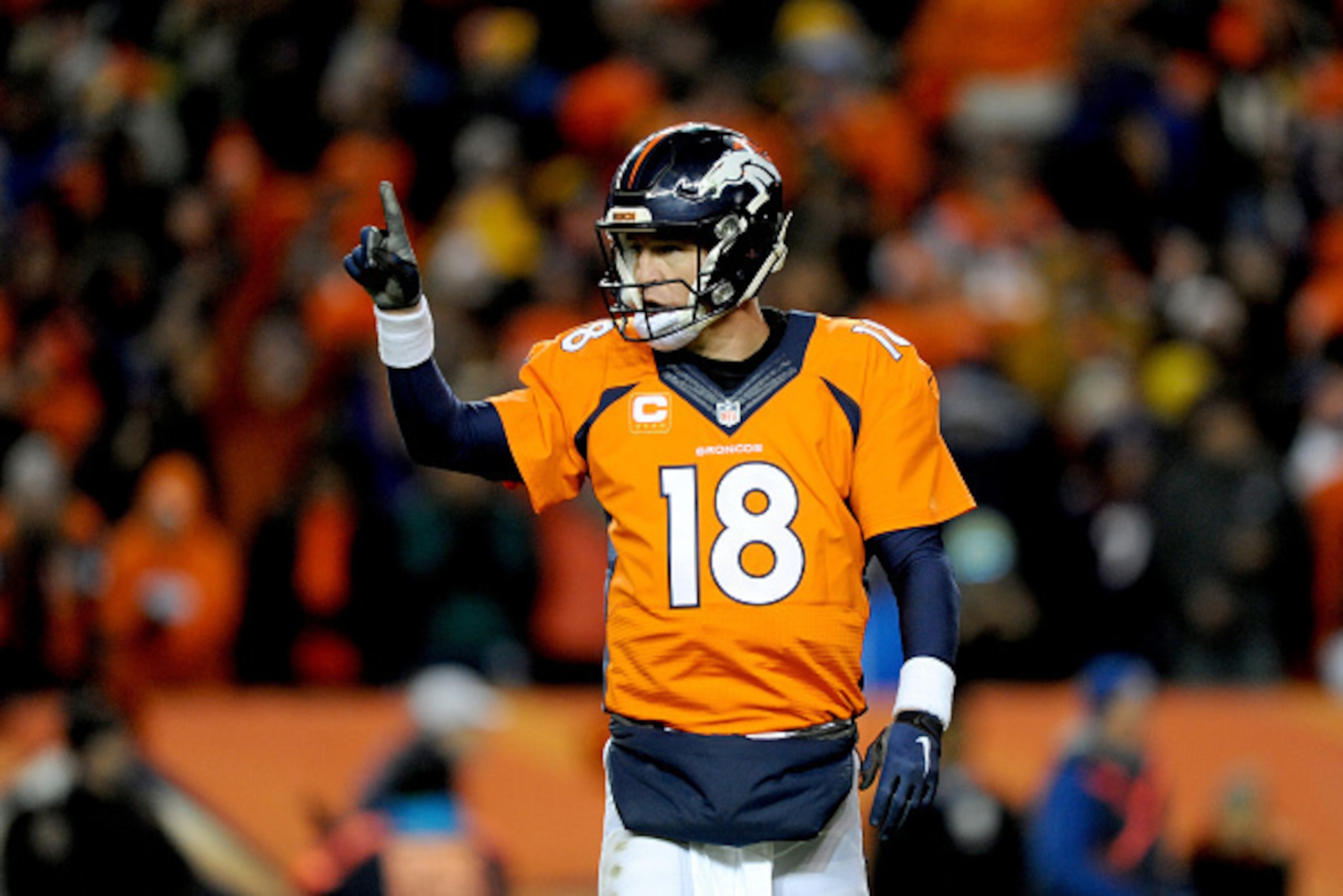 DENVER, CO - JANUARY 17: Peyton Manning #18 of the Denver Broncos signals to the sideline during the AFC Divisional Playoff Game against the Pittsburgh Steelers at Sports Authority Field at Mile High on January 17, 2016 in Denver, Colorado. (Photo by D DENVER, CO - JANUARY 17: Peyton Manning #18 of the Denver Broncos signals to the sideline during the AFC Divisional Playoff Game against the Pittsburgh Steelers at Sports Authority Field at Mile High on January 17, 2016 in Denver, Colorado. (Photo by D