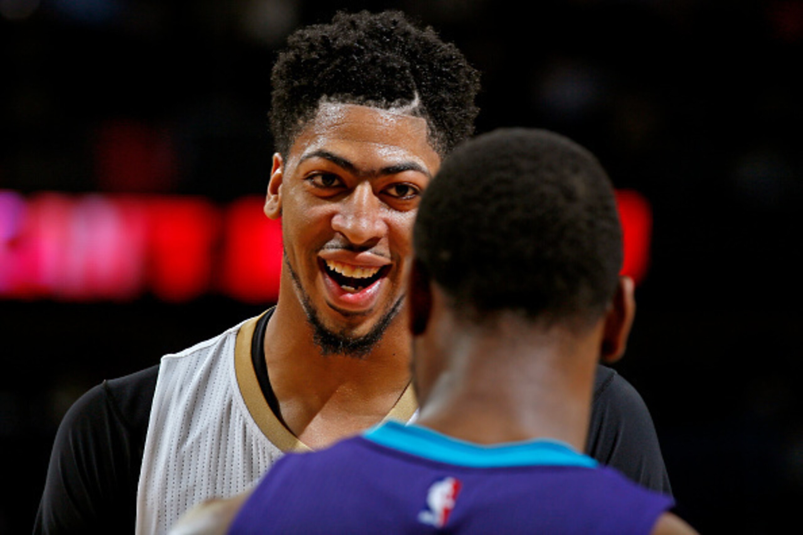 NEW ORLEANS, LA - JANUARY 15: A close up shot of Anthony Davis #23 of the New Orleans Pelicans smiling during the game against the Charlotte Hornets on January 15, 2016 at the Smoothie King Center in New Orleans, Louisiana. NOTE TO USER: User expressly a NEW ORLEANS, LA - JANUARY 15: A close up shot of Anthony Davis #23 of the New Orleans Pelicans smiling during the game against the Charlotte Hornets on January 15, 2016 at the Smoothie King Center in New Orleans, Louisiana. NOTE TO USER: User expressly a