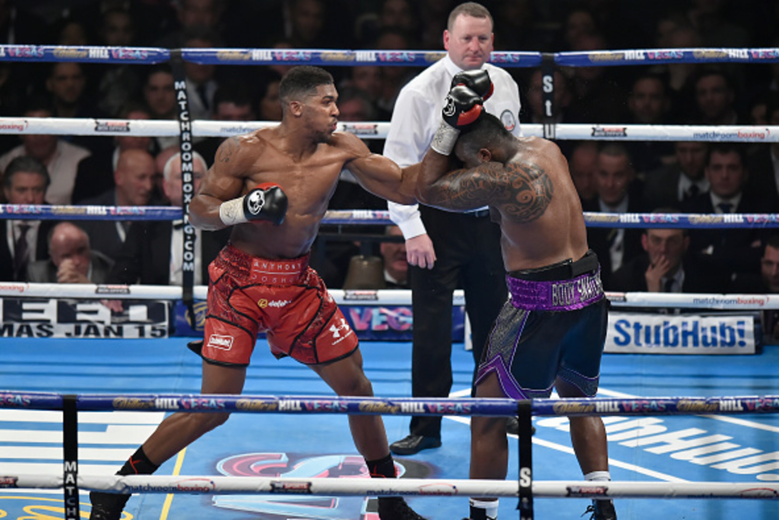 LONDON, ENGLAND - DECEMBER 12:  Anthony Joshua MBE (L) in boxing action against Dillian Whyte during the Commonwealth Heavyweight title, Vacant British Heavyweight title and WBC International Heavyweight title fight at The O2 Arena on December 12, 2015 in