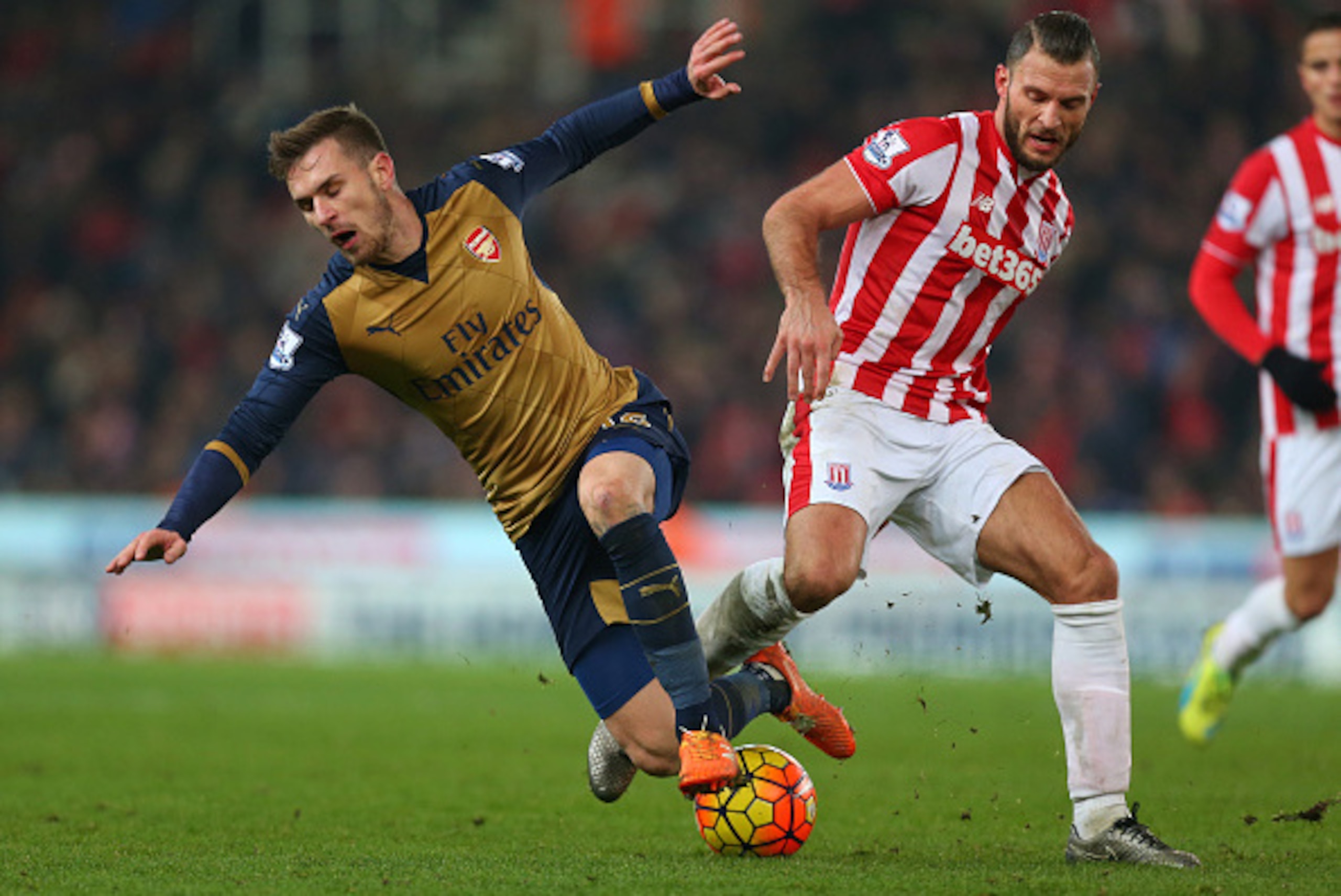 STOKE-ON-TRENT, ENGLAND - JANUARY 17: Erik Pieters of Stoke City and Aaron Ramsey of Arsenal during the Barclays Premier League match between Stoke City and Arsenal at the Britannia Stadium on January 17, 2016 in Stoke-on-Trent, England. (Photo by Catheri