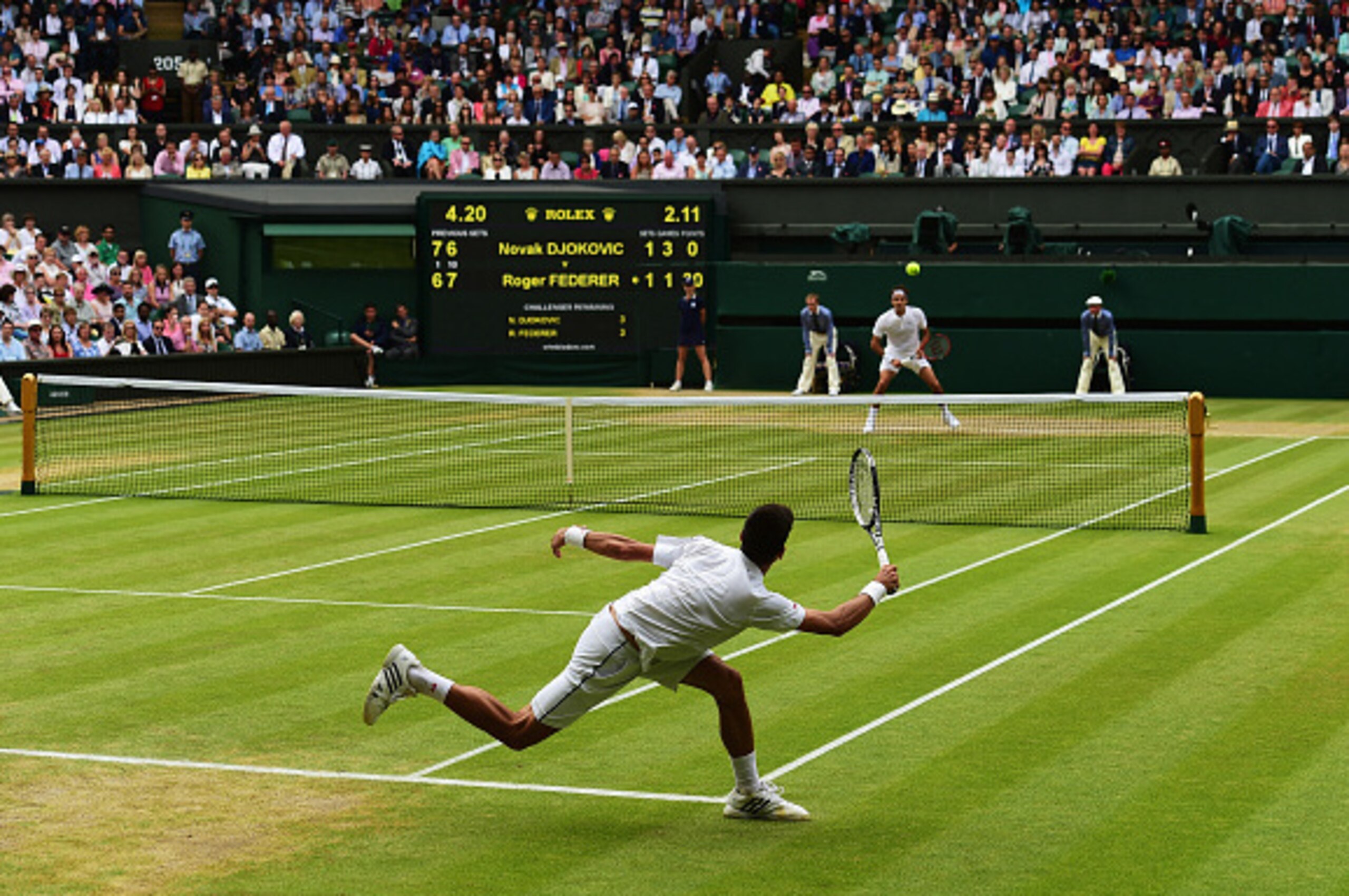 LONDON, ENGLAND - JULY 12:  Novak Djokovic of Serbia plays a forehand in the Final Of The Gentlemen's Singles against Roger Federer of Switzerland on day thirteen of the Wimbledon Lawn Tennis Championships at the All England Lawn Tennis and Croquet Club o