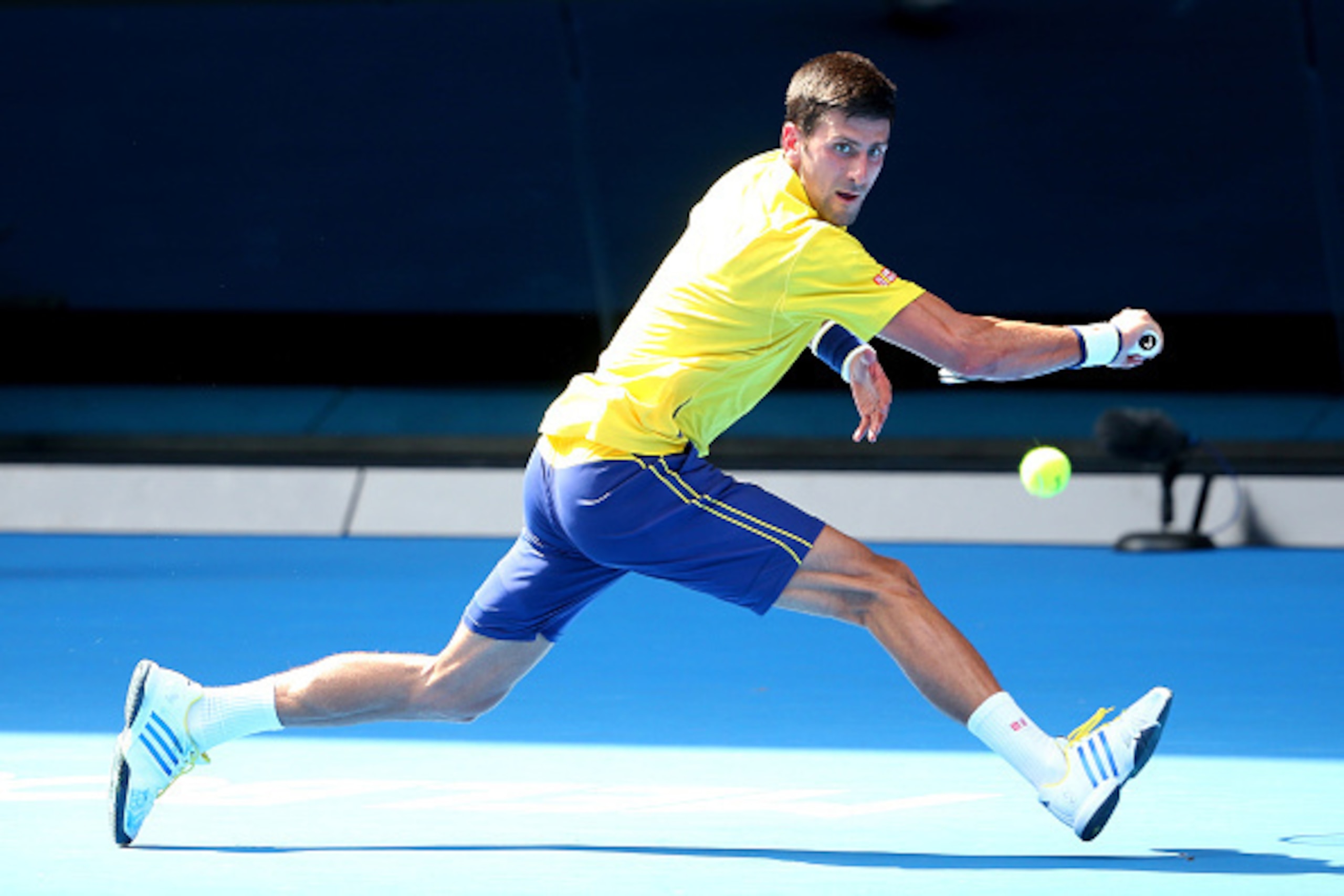 MELBOURNE, AUSTRALIA - JANUARY 18:  Novak Djokovic of Serbia plays a backhand in his first round match against Hyeon Chung of Korea during day one of the 2016 Australian Open at Melbourne Park on January 18, 2016 in Melbourne, Australia.  (Photo by Quinn 