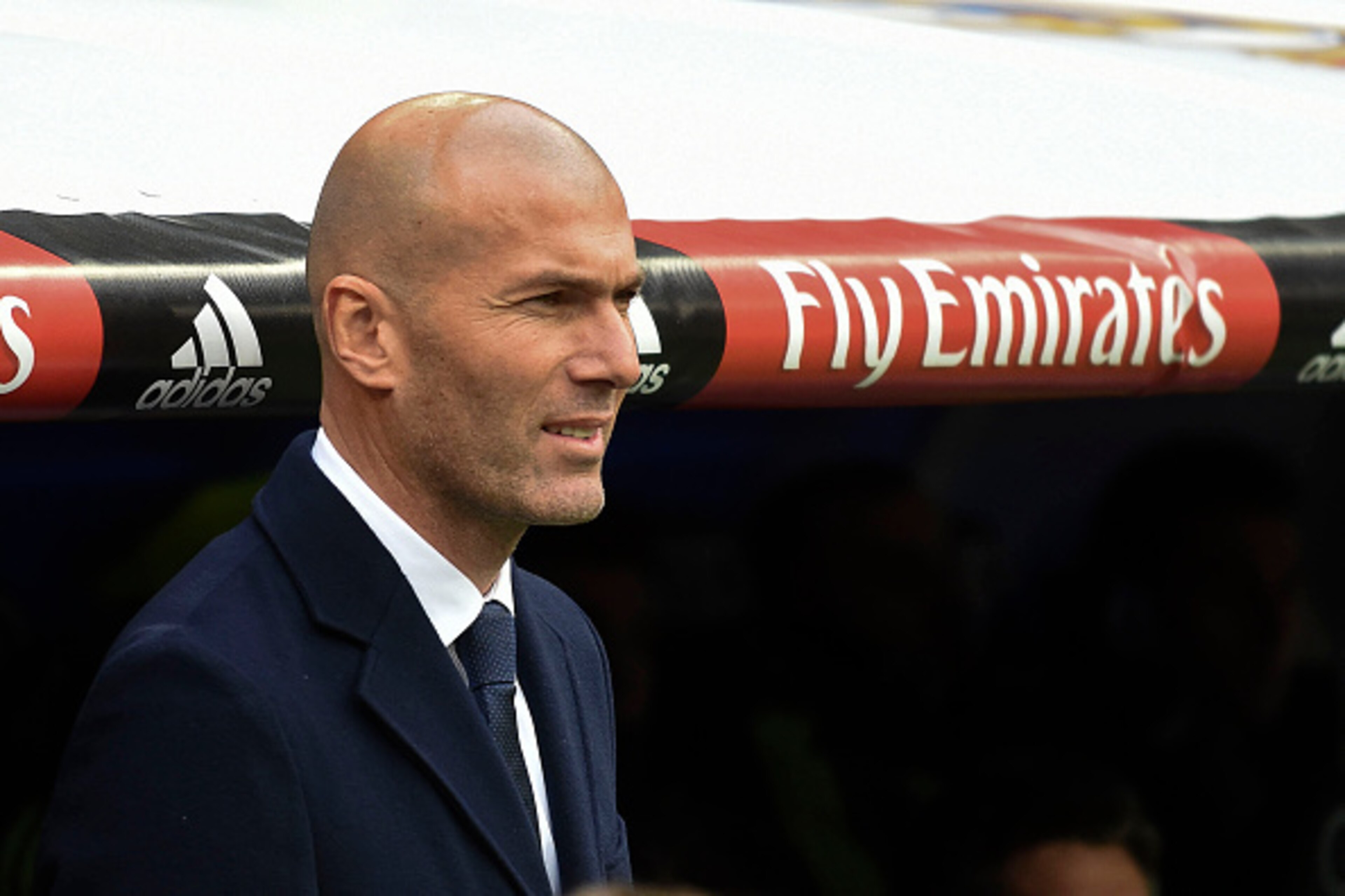 Real Madrid's French coach Zinedine Zidane looks on prior to the Spanish league football match Real Madrid CF vs Real Sporting de Gijon at the Santiago Bernabeu stadium in Madrid on January 17, 2016. Real Madrid won 5-1. AFP PHOTO/ PEDRO ARMESTRE / AFP Real Madrid's French coach Zinedine Zidane looks on prior to the Spanish league football match Real Madrid CF vs Real Sporting de Gijon at the Santiago Bernabeu stadium in Madrid on January 17, 2016. Real Madrid won 5-1. AFP PHOTO/ PEDRO ARMESTRE / AFP