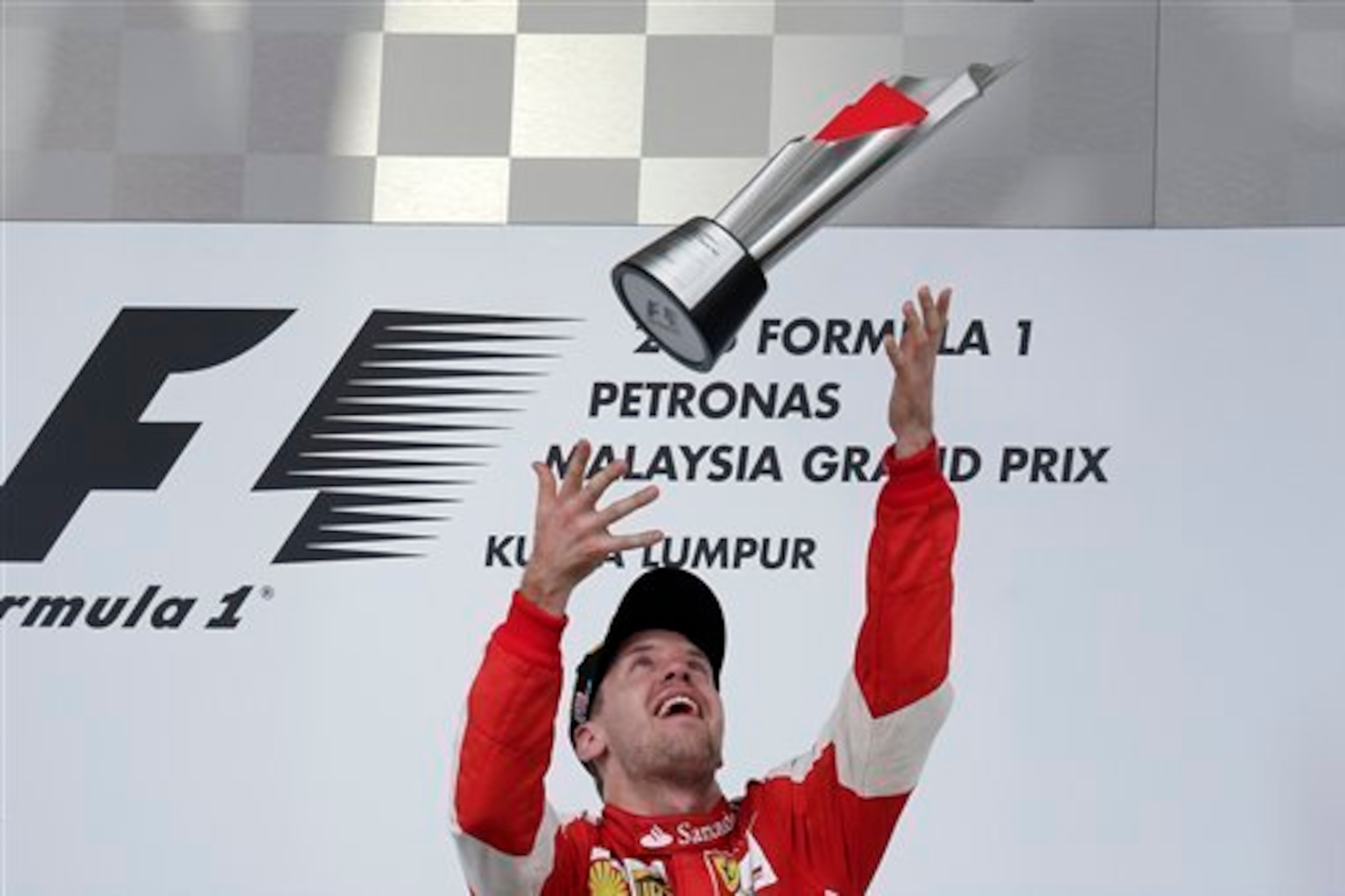 Sebastian Vettel celebrates winning the Malaysian Grand Prix.