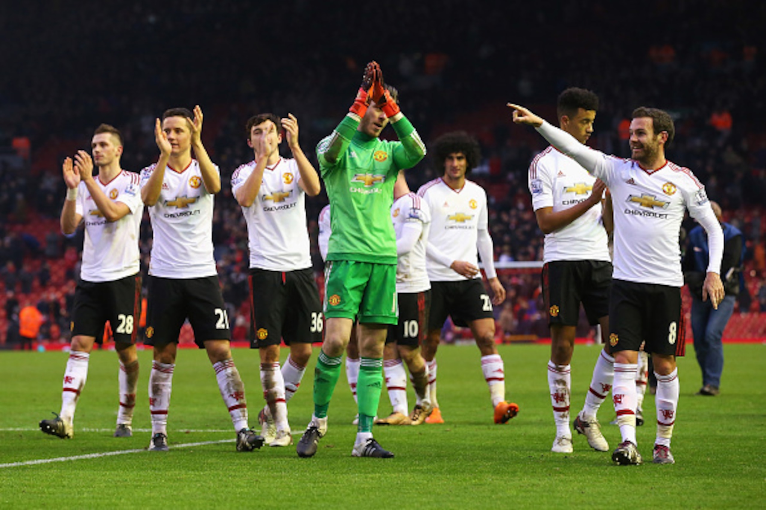 LIVERPOOL, ENGLAND - JANUARY 17: Manchester United players celebrate after the Barclays Premier League match between Liverpool and Manchester United at Anfield on January 17, 2016 in Liverpool, England.  (Photo by Alex Livesey/Getty Images)