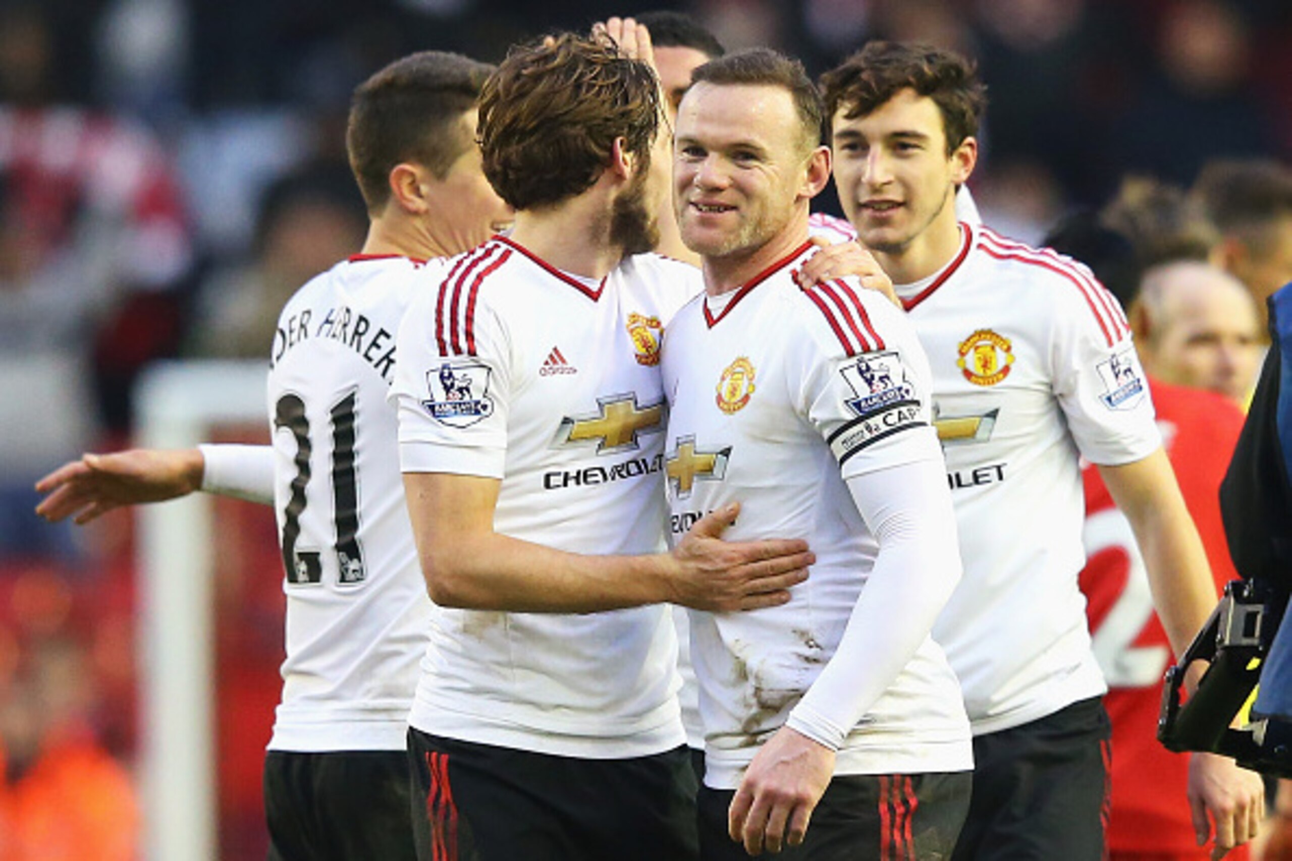 LIVERPOOL, ENGLAND - JANUARY 17:  Wayne Rooney of Manchester United celebrates victory with Daley Blind after the Barclays Premier League match between Liverpool and Manchester United at Anfield on January 17, 2016 in Liverpool, England.  (Photo by Alex L