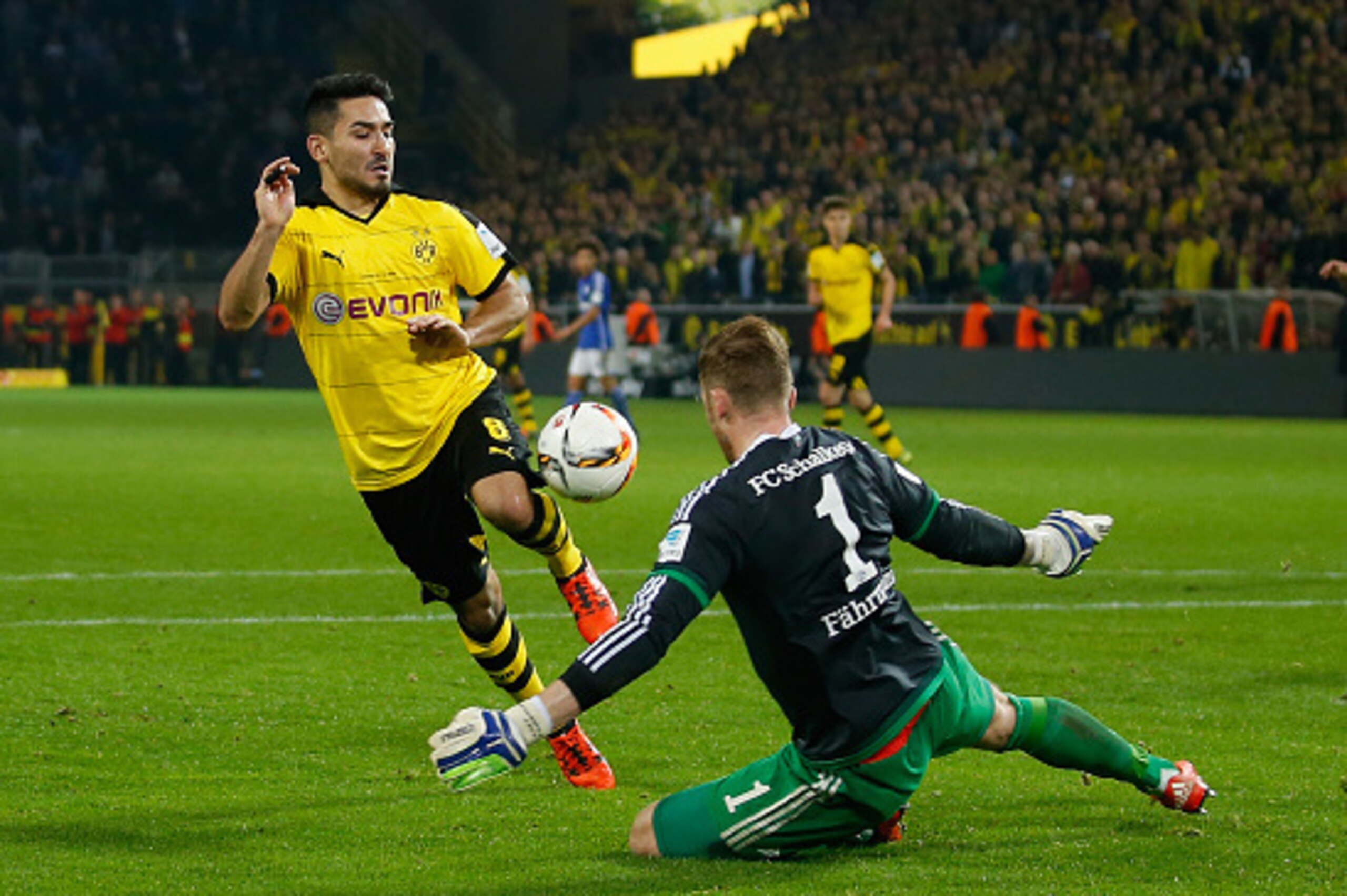 DORTMUND, GERMANY - NOVEMBER 08: Goalkeeper Ralf Faehrmann (R) of Schalke saves a ball of Ilkay Guendogan of Dortmund during the Bundesliga match between Borussia Dortmund and FC Schalke 04 at Signal Iduna Park on November 8, 2015 in Dortmund, Germany. ( DORTMUND, GERMANY - NOVEMBER 08: Goalkeeper Ralf Faehrmann (R) of Schalke saves a ball of Ilkay Guendogan of Dortmund during the Bundesliga match between Borussia Dortmund and FC Schalke 04 at Signal Iduna Park on November 8, 2015 in Dortmund, Germany. (