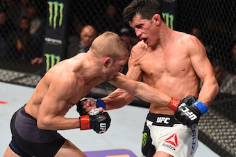 BOSTON, MA - JANUARY 17:  (L-R) TJ Dillashaw and Dominick Cruz trade punches in their UFC bantamweight championship bout during the UFC Fight Night event inside TD Garden on January 17, 2016 in Boston, Massachusetts. (Photo by Jeff Bottari/Zuffa LLC/Zuffa