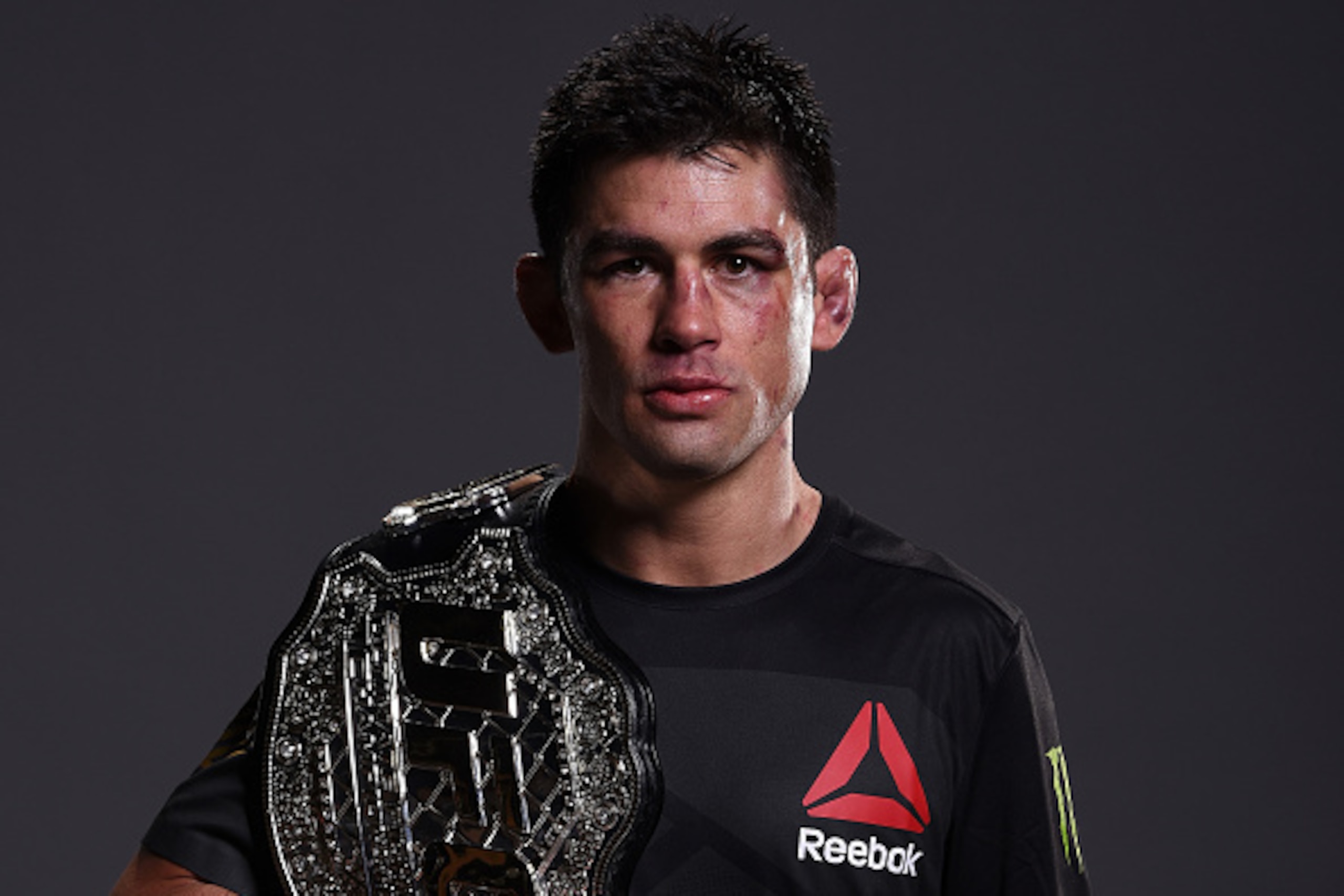 BOSTON, MA - JANUARY 17:  New UFC bantamweight champion Dominick Cruz poses for a portrait backstage after his victory over TJ Dillashaw during the UFC Fight Night event inside TD Garden on January 17, 2016 in Boston, Massachusetts. (Photo by Mike Roach/Z