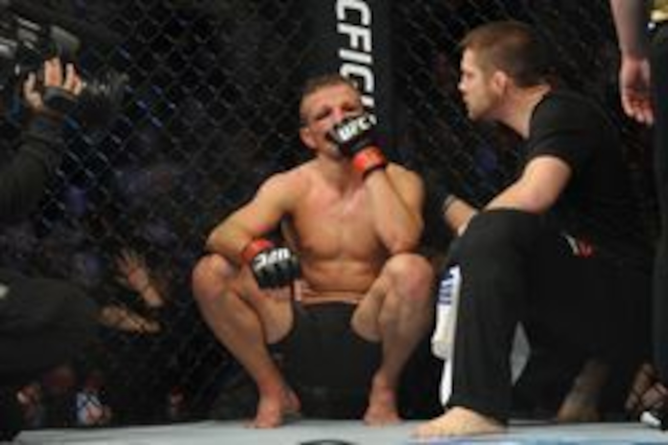 Jan 17, 2016; Boston, MA, USA; TJ Dillashaw (red) looks on after his loss to Dominick Cruz (not pictured) in a world bantamweight championship bout at UFC Fight Night at the TD Garden.  Cruz won after five rounds by split decision. Mandatory Credit: Bob D