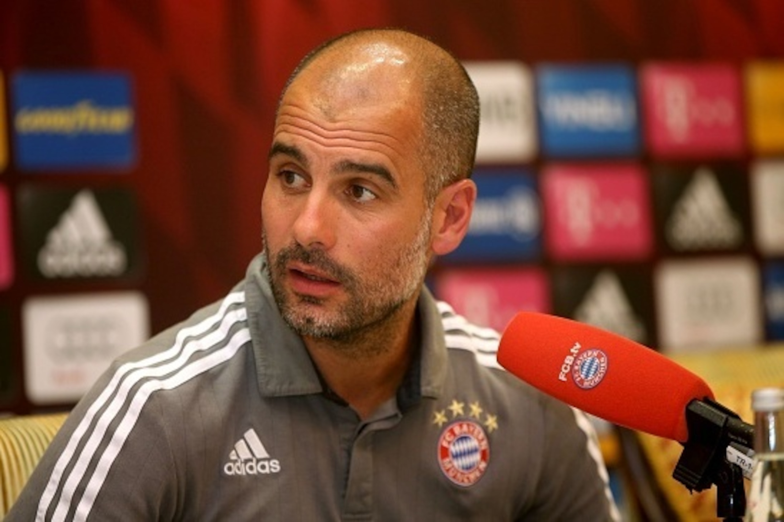 Bayern Munich's Spanish head coach Pep Guardiola speaks during a press conference at Aspire Academ in the Qatari capital Doha on January 11, 2016. / AFP / STRINGER        (Photo credit should read STRINGER/AFP/Getty Images)