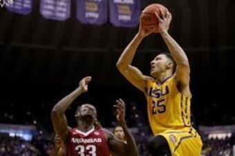 Jan 16, 2016; Baton Rouge, LA, USA; LSU Tigers forward Ben Simmons (25) shoots over Arkansas Razorbacks forward Moses Kingsley (33) during the second half of a game at the Pete Maravich Assembly Center. LSU defeated Arkansas 76-74. Mandatory Credit: Deric