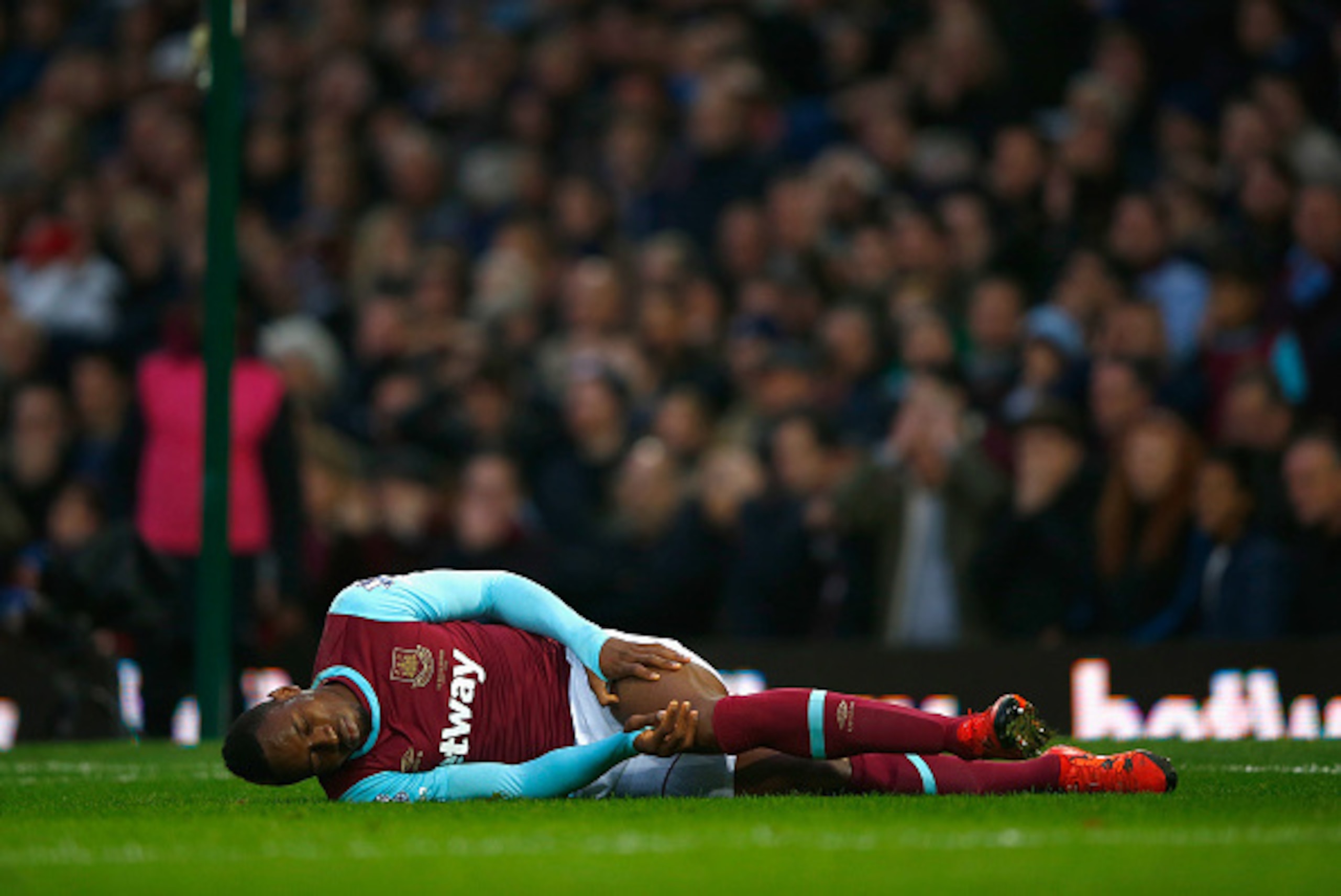 LONDON, ENGLAND - NOVEMBER 29:  Diafra Sakho of West Ham United holds his leg with an injury during the Barclays Premier League match between West Ham United and West Bromwich Albion at the Boleyn Ground on November 29, 2015 in London, England.  (Photo by
