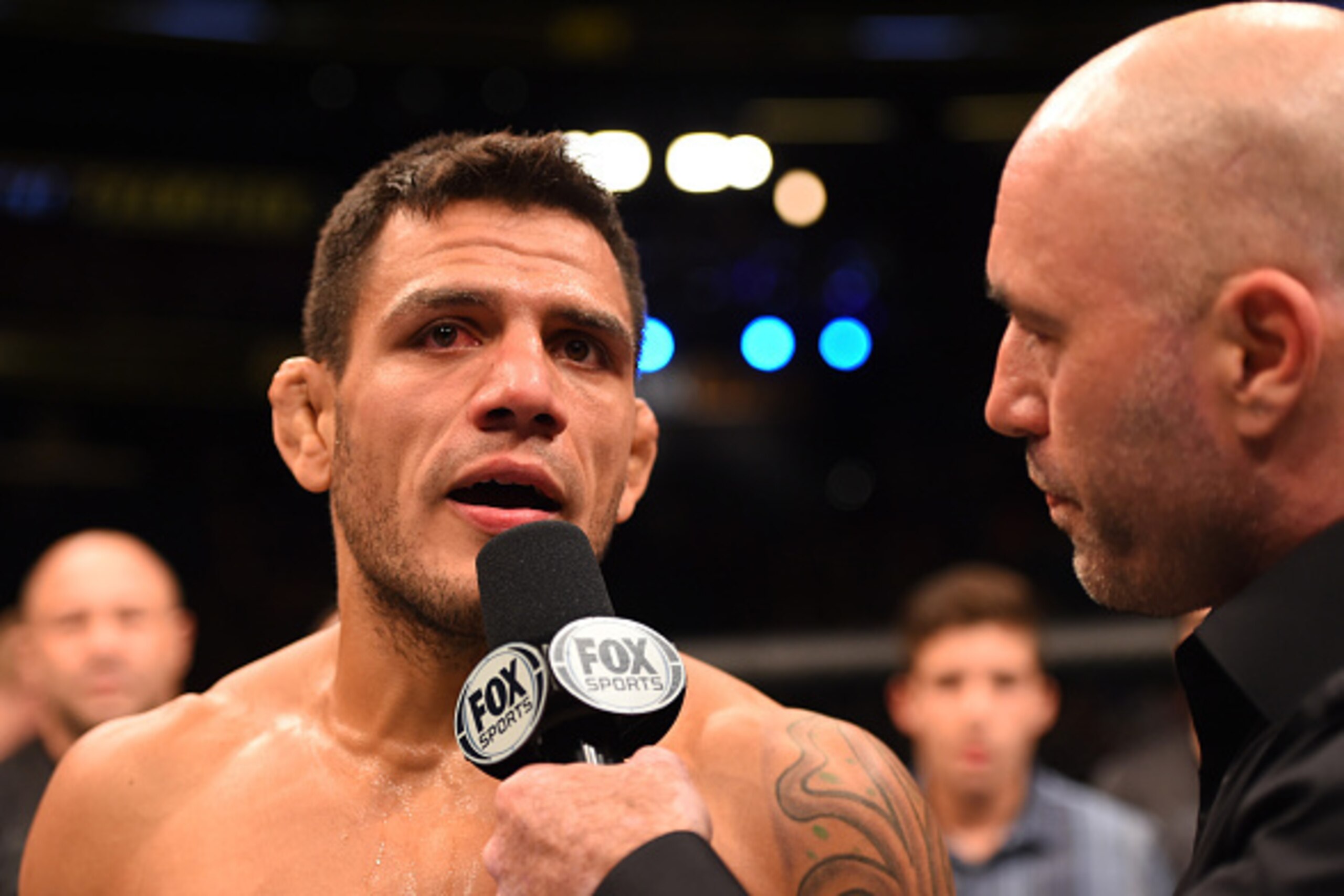 ORLANDO, FL - DECEMBER 19:   Rafael dos Anjos speaks with Joe Rogan after his TKO victory over Donald Cerrone in their UFC lightweight title bout during the UFC Fight Night event at the Amway Center on December 19, 2015 in Orlando, Florida. (Photo by Josh