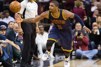 CLEVELAND, OH - JANUARY 18: Kyrie Irving #2 of the Cleveland Cavaliers dives for a loose ball during the second half against the Golden State Warriors at Quicken Loans Arena on January 18, 2016 in Cleveland, Ohio. The Warriors defeated the Cavaliers 132-9
