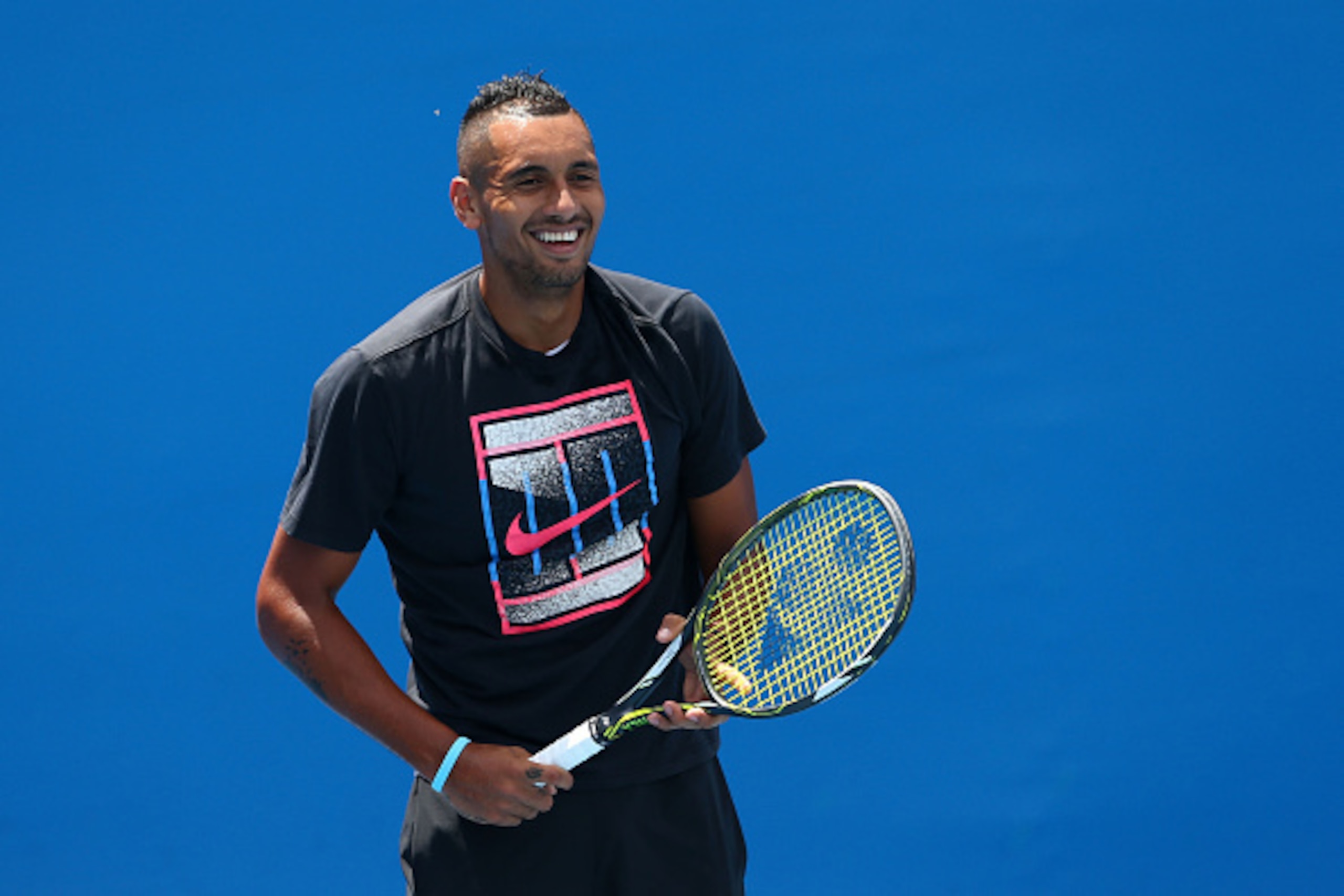 MELBOURNE, AUSTRALIA - JANUARY 19:  Nick Kyrgios of Australia smiles during a practice session on day two of the 2016 Australian Open at Melbourne Park on January 19, 2016 in Melbourne, Australia.  (Photo by Cameron Spencer/Getty Images)