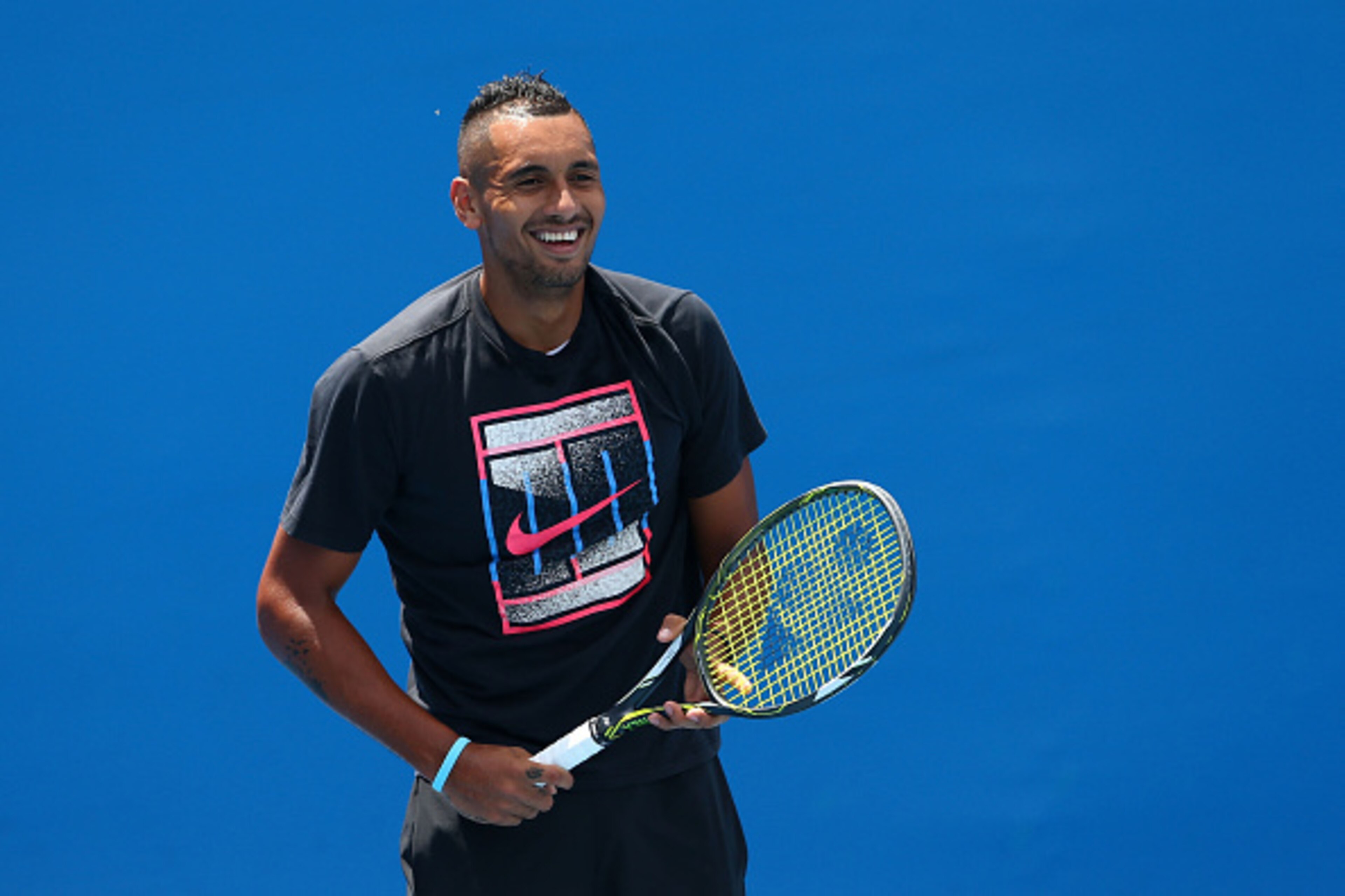 MELBOURNE, AUSTRALIA - JANUARY 19:  Nick Kyrgios of Australia smiles during a practice session on day two of the 2016 Australian Open at Melbourne Park on January 19, 2016 in Melbourne, Australia.  (Photo by Cameron Spencer/Getty Images)