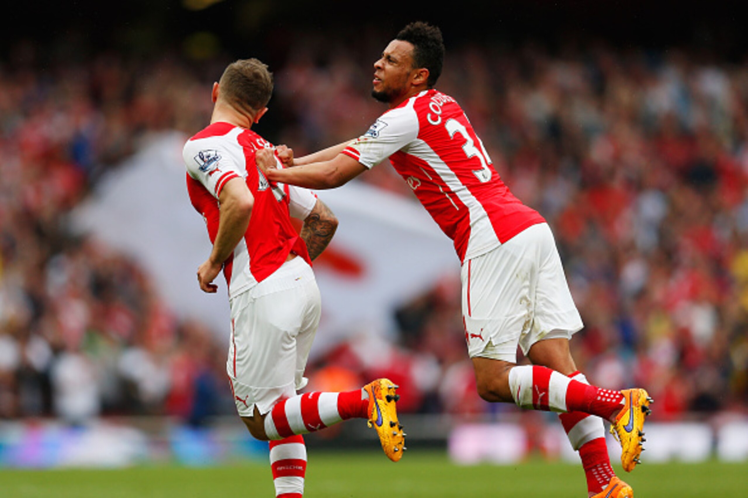 LONDON, ENGLAND - MAY 24:  Jack Wilshere (L) of Arsenal celebrates scoring his team's third goal with his team mate Francis Coquelin during the Barclays Premier League match between Arsenal and West Bromwich Albion at Emirates Stadium on May 24, 2015 in L