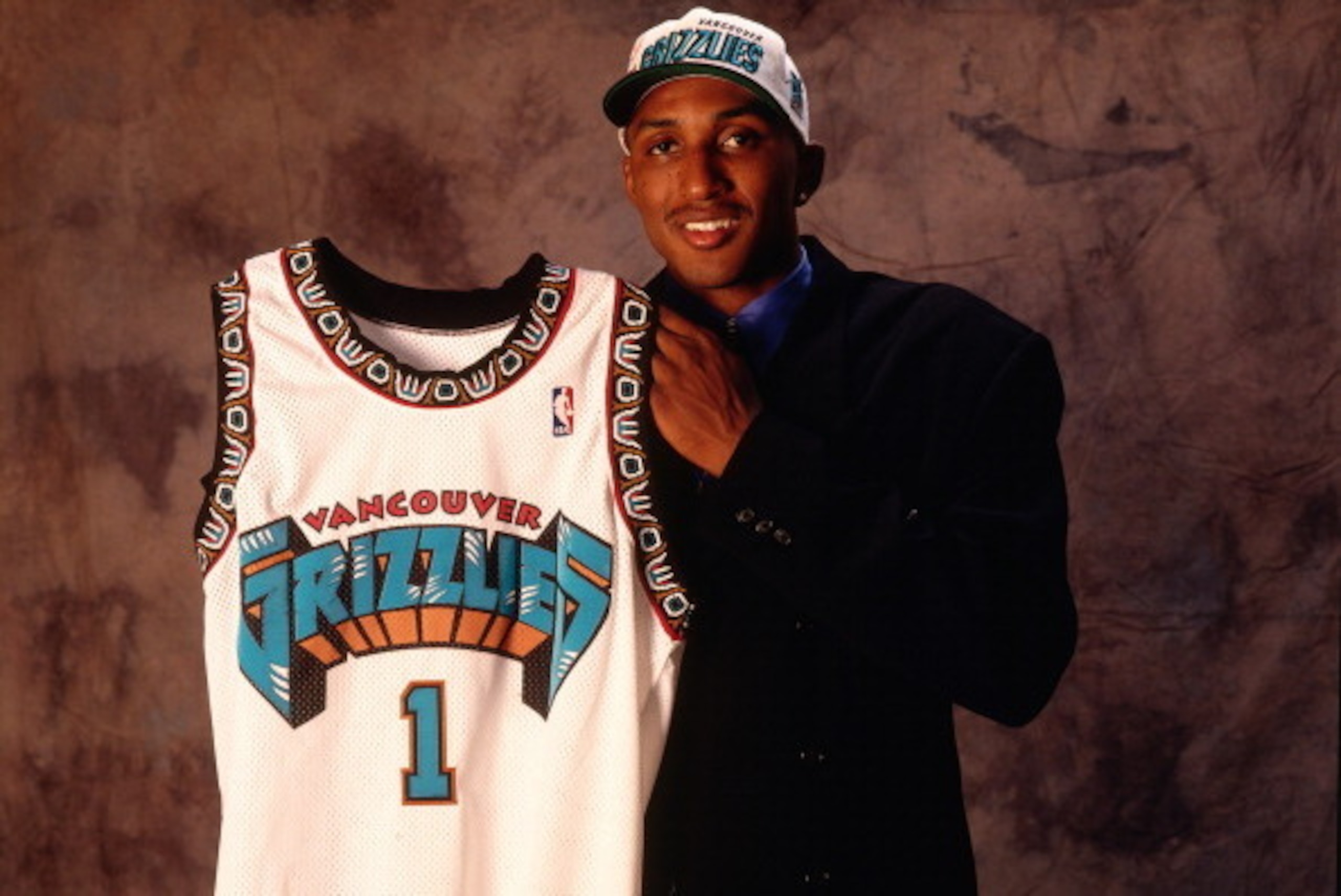 EAST RUTHERFORD, N.J. - JUNE 26: Shareef Abdur-Rahim poses for a portrait after he was choosen number three overall by the Vancouver Grizzlies during the 1996 NBA Draft on June 26, 1996 at the Continental Airlines Arena in East Ruthford, New Jersey. NOTE 