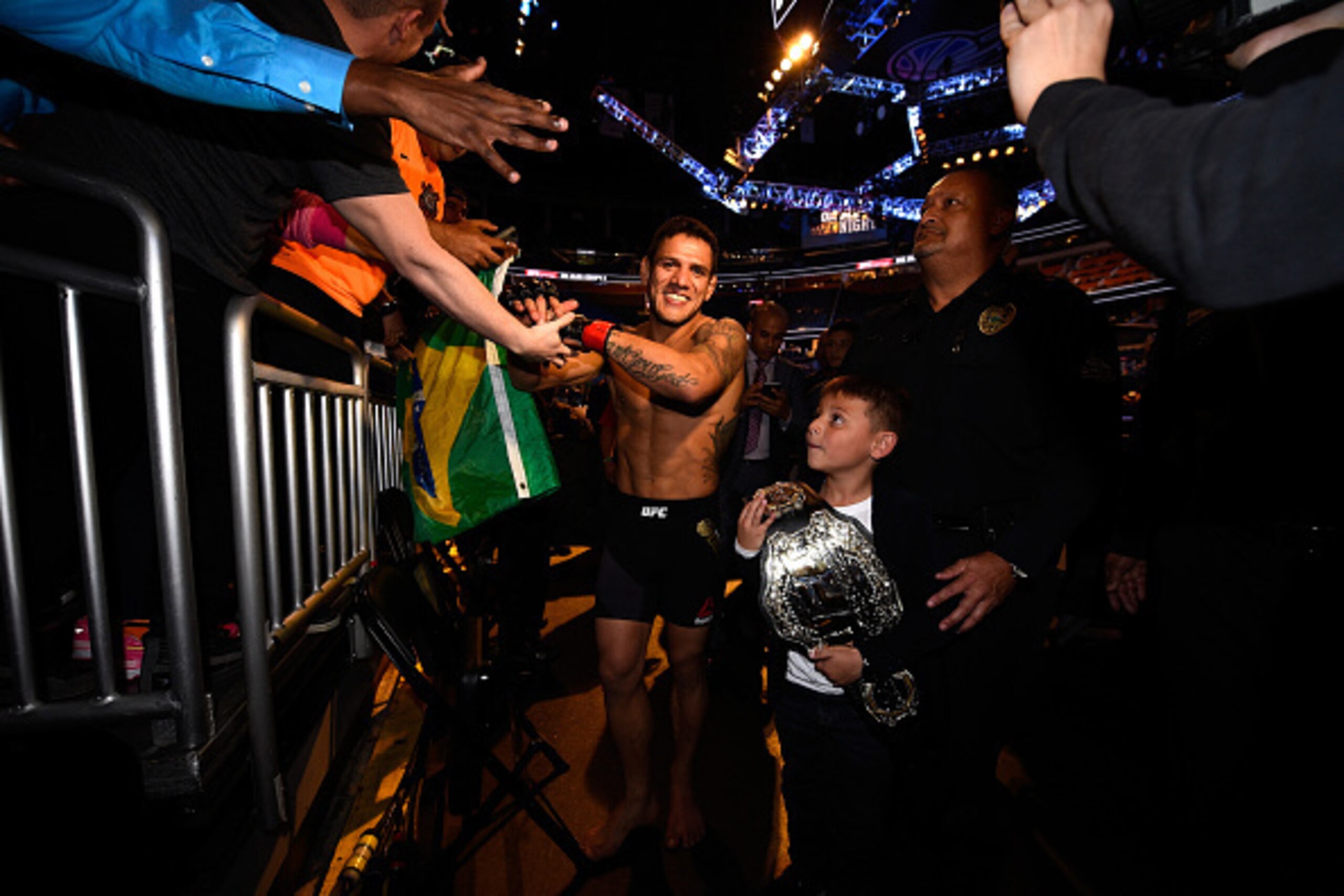 ORLANDO, FL - DECEMBER 19:   Rafael dos Anjos celebrates his TKO victory over Donald Cerrone in their UFC lightweight title bout during the UFC Fight Night event at the Amway Center on December 19, 2015 in Orlando, Florida. (Photo by Jeff Bottari/Zuffa LL