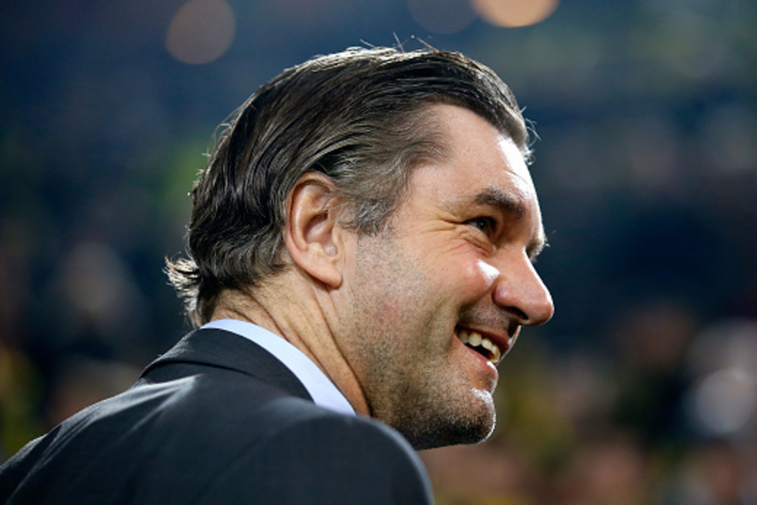 DORTMUND, GERMANY - MARCH 18:  Manager Michael Zorc of Dortmund smiles prior to the UEFA Champions League Round of 16 second leg match between Borussia Dortmund and Juventus at Signal Iduna Park on March 18, 2015 in Dortmund, Germany.  (Photo by Boris Str