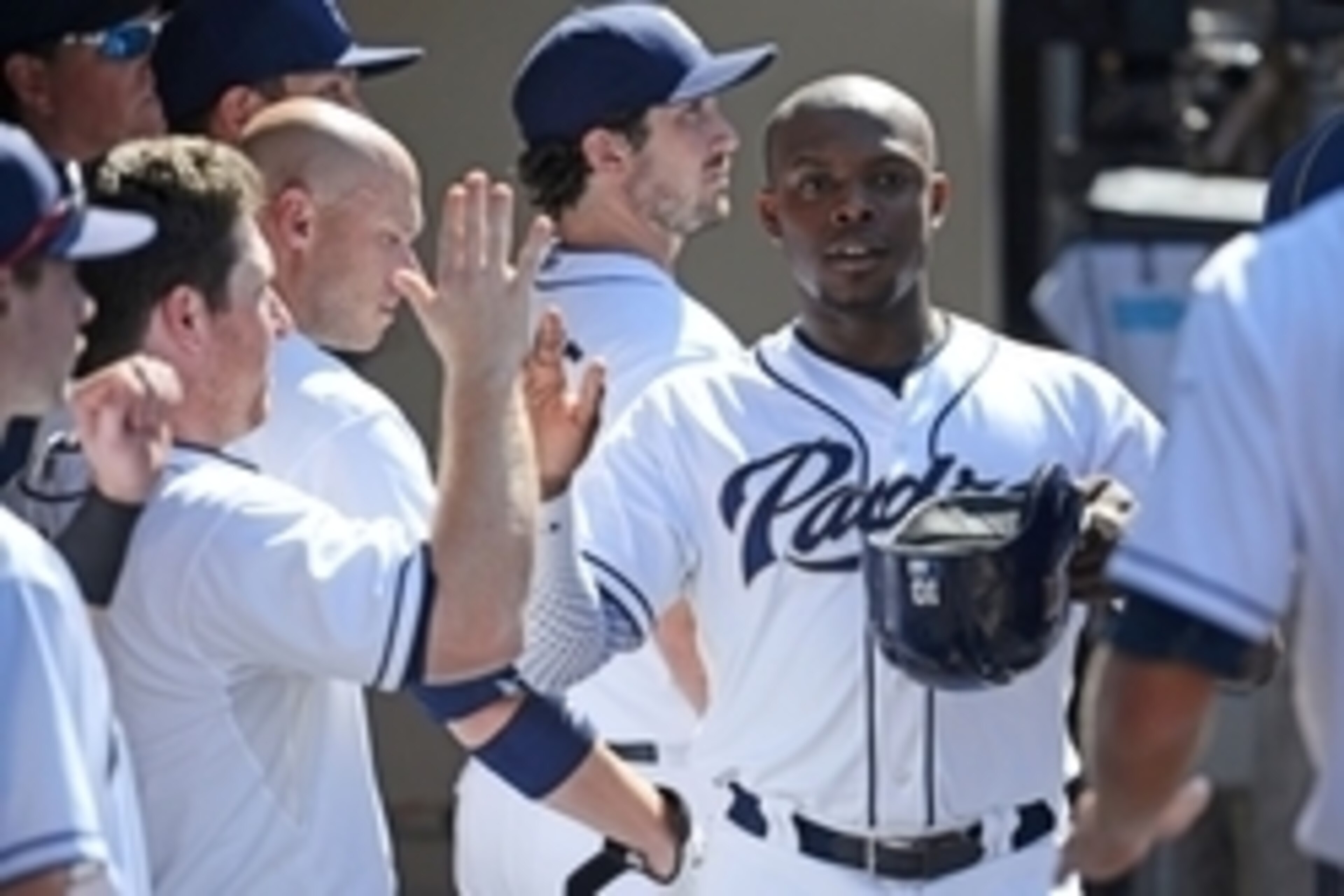Sep 7, 2015; San Diego, CA, USA; San Diego Padres left fielder Justin Upton (10) is congratulated after scoring during the sixth inning against the Colorado Rockies at Petco Park. Mandatory Credit: Jake Roth-USA TODAY Sports