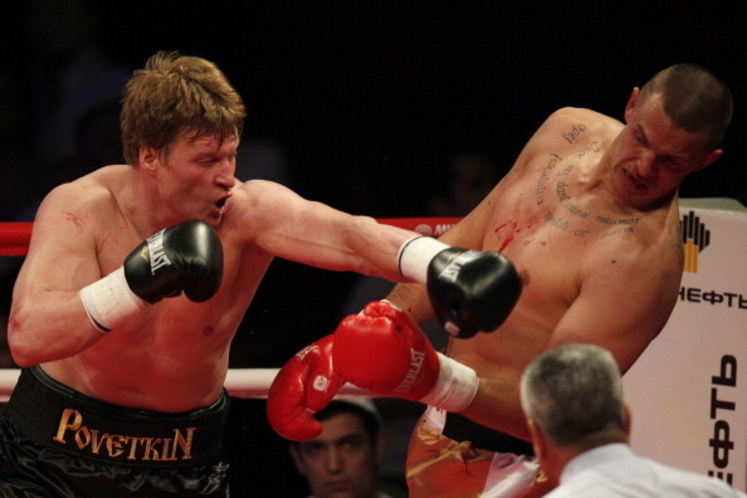 MOSCOW, RUSSIA - MAY 17: Alexander Povetkin (L) of Russia fights with Andrzej Wawrzik of Poland during their WBA heavyweight title bout at the Crocus City Hall on May 17, 2013 in Moscow, Russia.  (Photo by Dmitry Korotayev/Epsilon/Getty Images)
