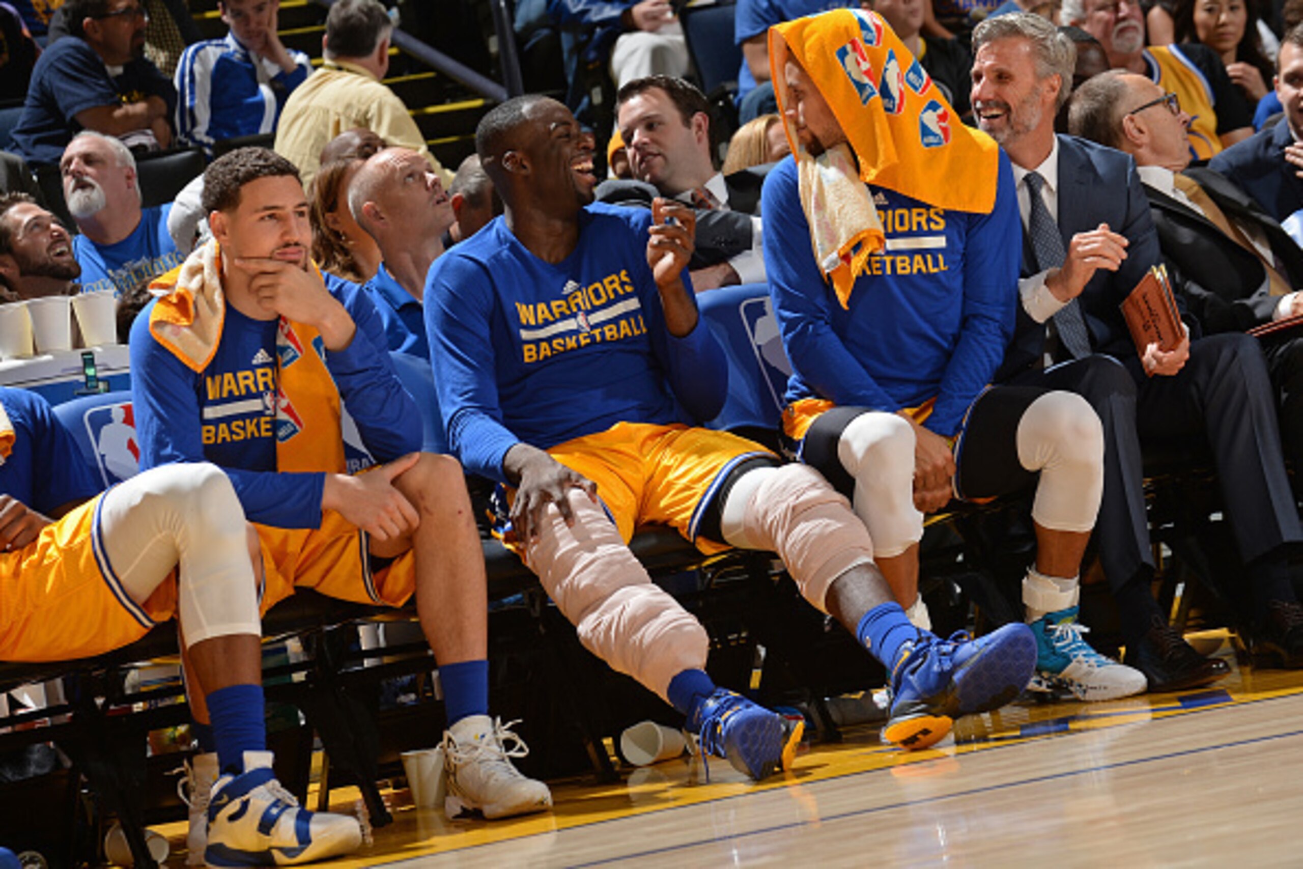 OAKLAND, CA - NOVEMBER 24: Klay Thompson #11, Draymond Green #23 and Stephen Curry #30 of the Golden State Warriors sit on the bench during the game against the Los Angeles Lakers on November 24, 2015 at ORACLE Arena in Oakland, California. NOTE TO USER: OAKLAND, CA - NOVEMBER 24: Klay Thompson #11, Draymond Green #23 and Stephen Curry #30 of the Golden State Warriors sit on the bench during the game against the Los Angeles Lakers on November 24, 2015 at ORACLE Arena in Oakland, California. NOTE TO USER: