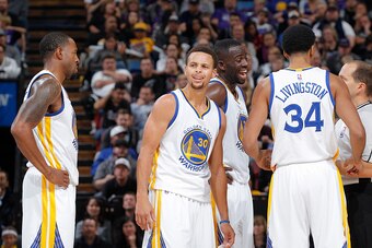 SACRAMENTO, CA - NOVEMBER 7: Andre Iguodala #9, Stephen Curry #30, Draymond Green #23 and Shaun Livingston #34 face the Sacramento Kings on November 7, 2015 at Sleep Train Arena in Sacramento, California. NOTE TO USER: User expressly acknowledges and agre