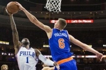 Dec 18, 2015; Philadelphia, PA, USA; New York Knicks forward Kristaps Porzingis (6) blocks the shot attempt of Philadelphia 76ers guard Tony Wroten (1) during the first half at Wells Fargo Center. The Knicks won 107-97. Mandatory Credit: Bill Streicher-US