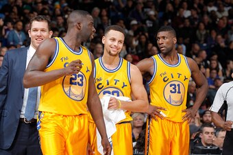 SACRAMENTO, CA - JANUARY 9: Draymond Green #23, Stephen Curry #30 and Festus Ezeli #31 of the Golden State Warriors face the Sacramento Kings on January 9, 2016 at Sleep Train Arena in Sacramento, California. NOTE TO USER: User expressly acknowledges and 