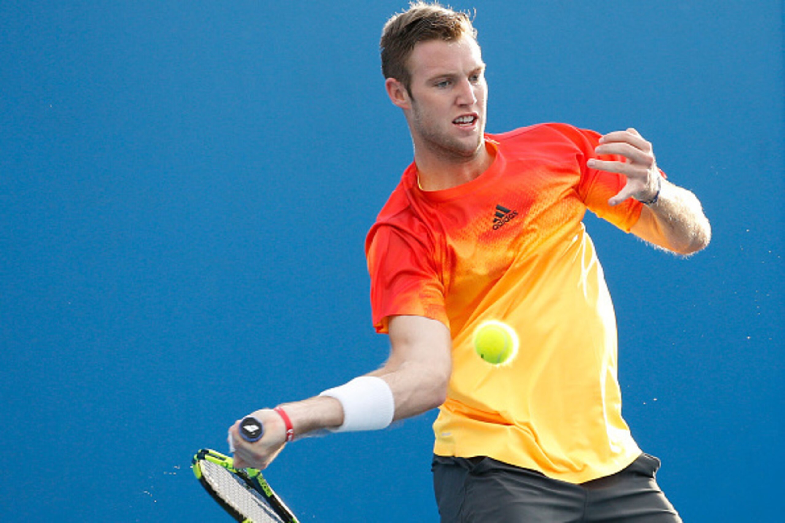 MELBOURNE, AUSTRALIA - JANUARY 19:  Jack Sock of the United States plays a forehand in his first round match against Taylor Fritz of the United States during day two of the 2016 Australian Open at Melbourne Park on January 19, 2016 in Melbourne, Australia