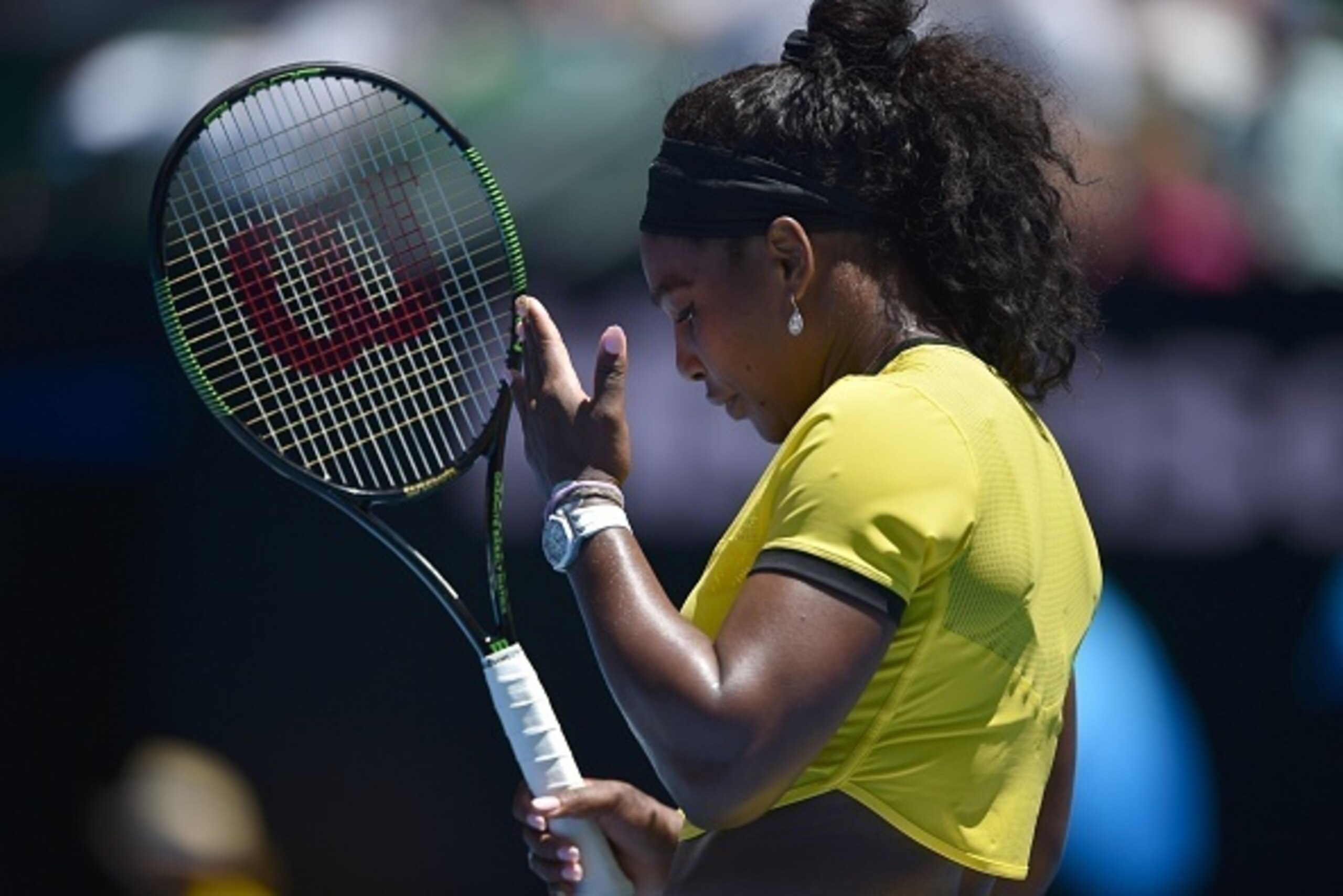 Serena Williams of the US gestures during her women's singles match against Taiwan's Hsieh Su-Wei on day three of the 2016 Australian Open tennis tournament in Melbourne on January 20, 2016. AFP PHOTO / PETER PARKS-- IMAGE RESTRICTED TO EDITORIAL USE - ST