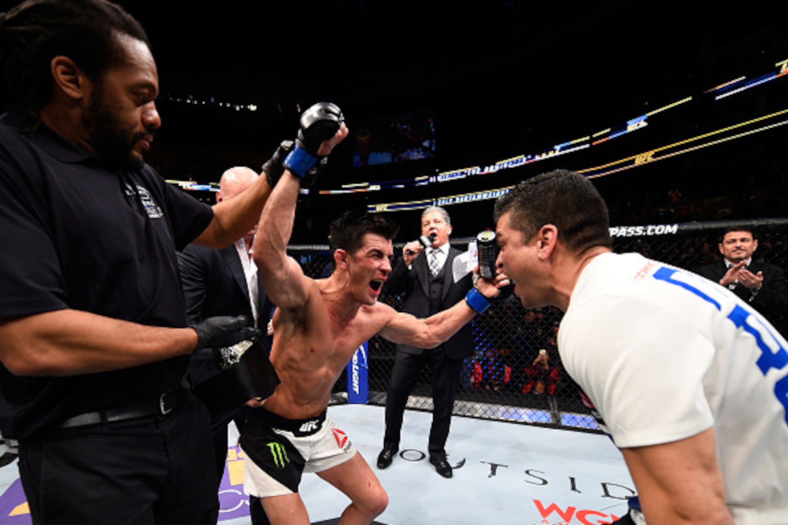 BOSTON, MA - JANUARY 17:  Dominick Cruz celebrates his split-decision victory over TJ Dillashaw in their UFC bantamweight championship bout during the UFC Fight Night event inside TD Garden on January 17, 2016 in Boston, Massachusetts. (Photo by Jeff Bott