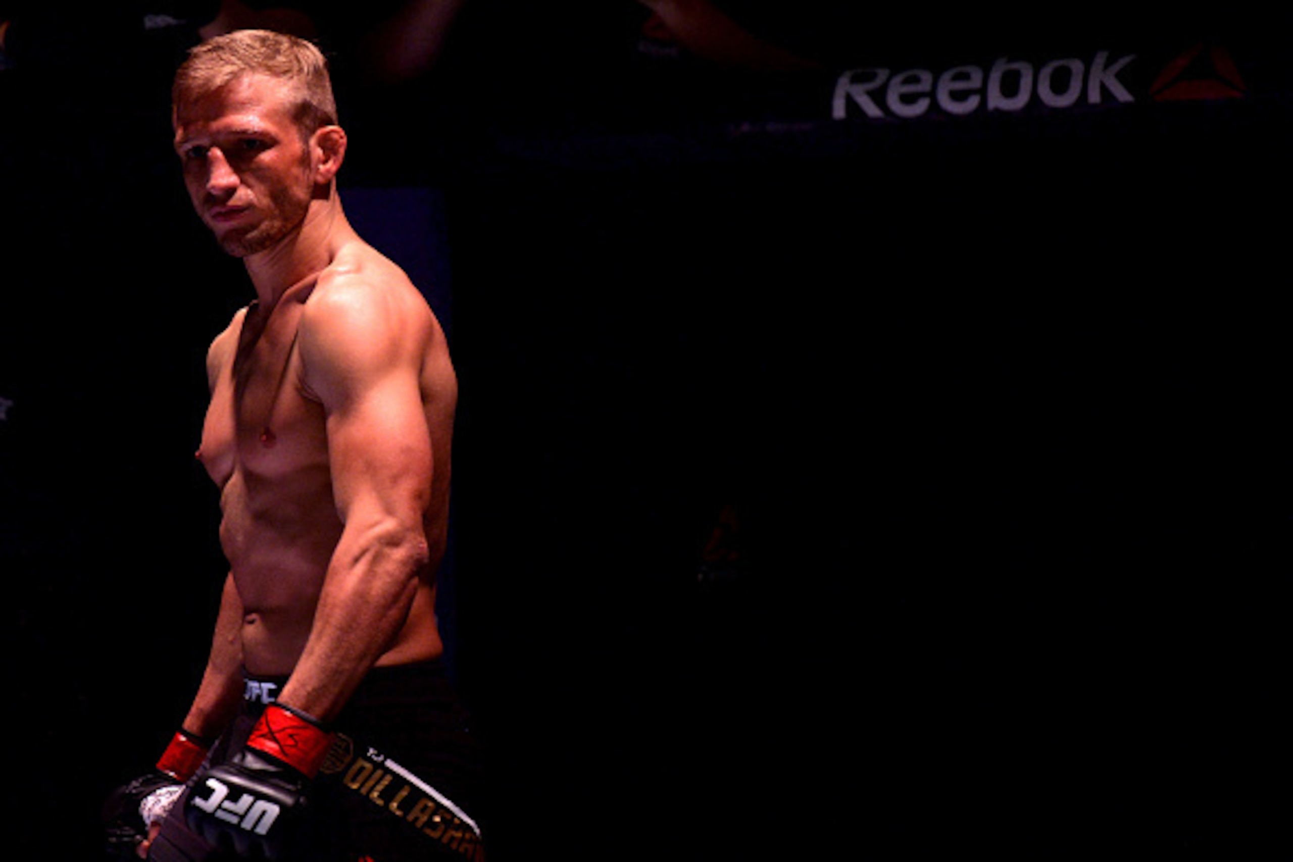 BOSTON, MA - JANUARY 17:  TJ Dillashaw enters the Octagon before facing Dominick Cruz in their UFC bantamweight championship bout during the UFC Fight Night event inside TD Garden on January 17, 2016 in Boston, Massachusetts. (Photo by Brandon Magnus/Zuff